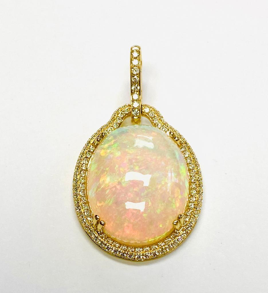 Large Flat Oval Opal Pendant with Diamonds in 18K Yellow Gold, from 'G-One' Collection

Stone size: 22 x 18 mm

Gemstone Weight; 16.44 Carats

Diamond: G-H / VS, Approx Wt: 0.89 Carats

*Chain Sold Separately