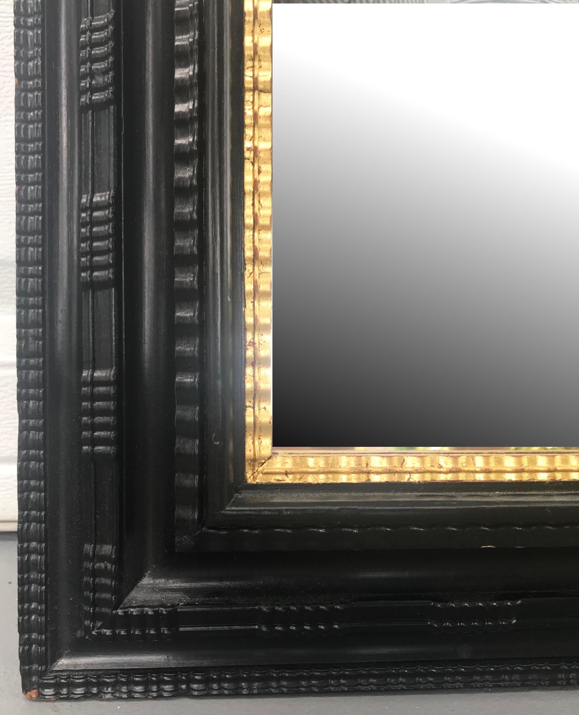 Dutch Colonial Large Flemish Ebonized Ripple Frame Mirror with Gilded Liner, circa 1900