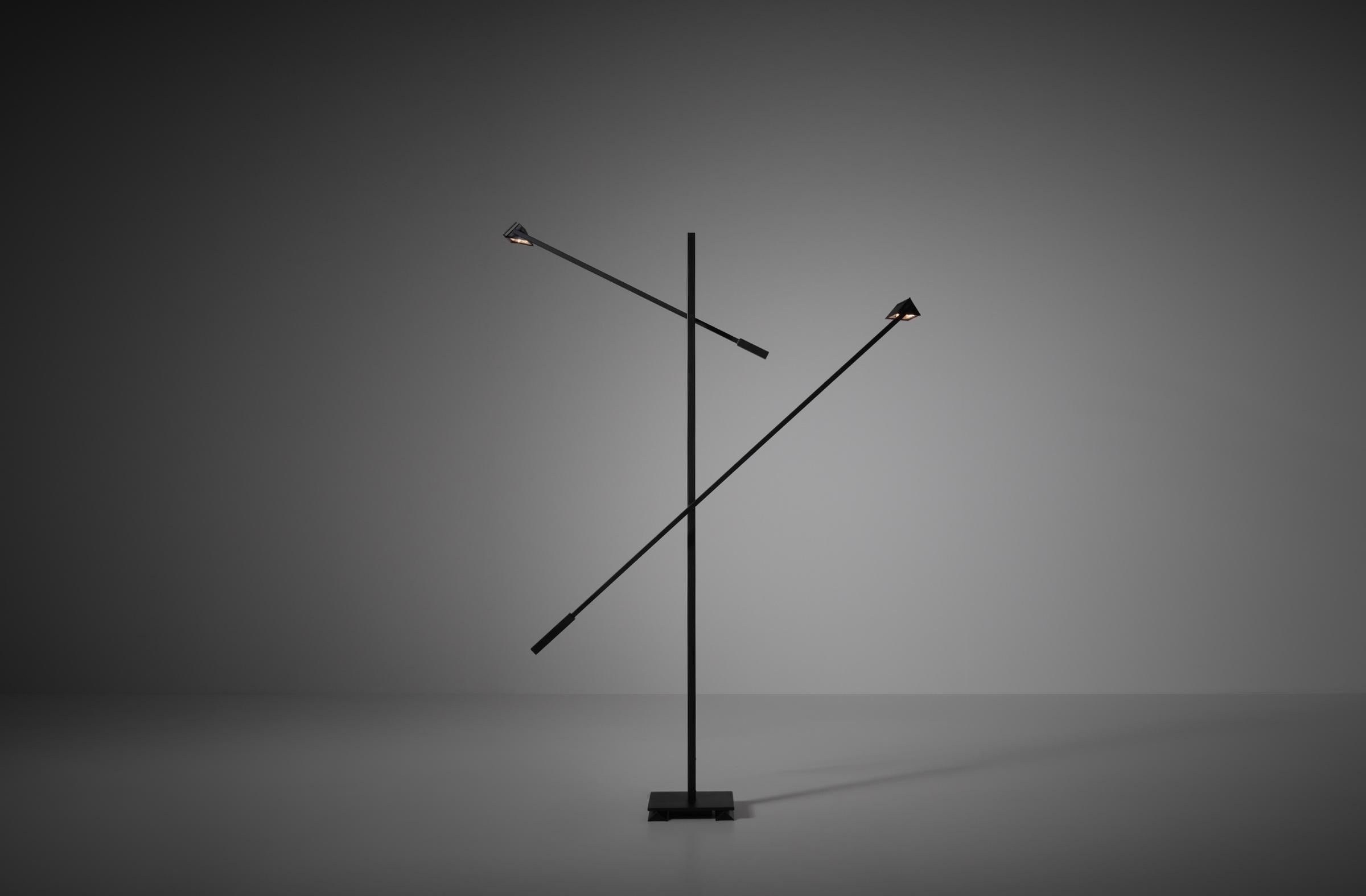 Large and sculptural Post Modern floor lamp 'Mikado' by Michel Senné for Arlumière, France 1970s. The lamp is constructed out a of black lacquered rectangular metal frame with two triangle shaped adjustable shades. A striking appearance due to its