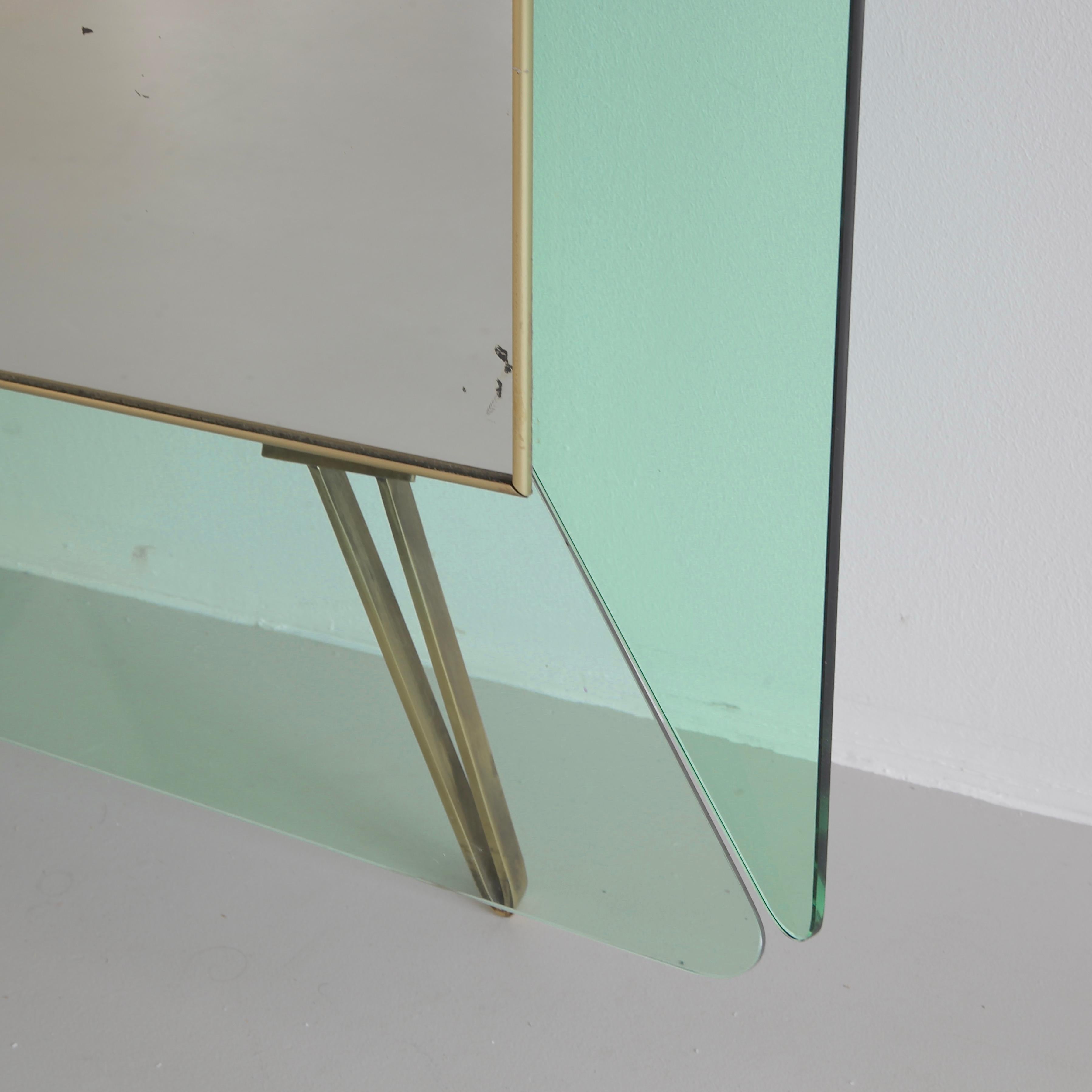 Floor mirror, framed with coloured glass. Italy, Cristal Arte, late 1950s/ early 1960s.

A large dimension floor mirror produced in Torino. The mirror is framed with six light green glass panels and offers a thick shaped glass console. The mirror