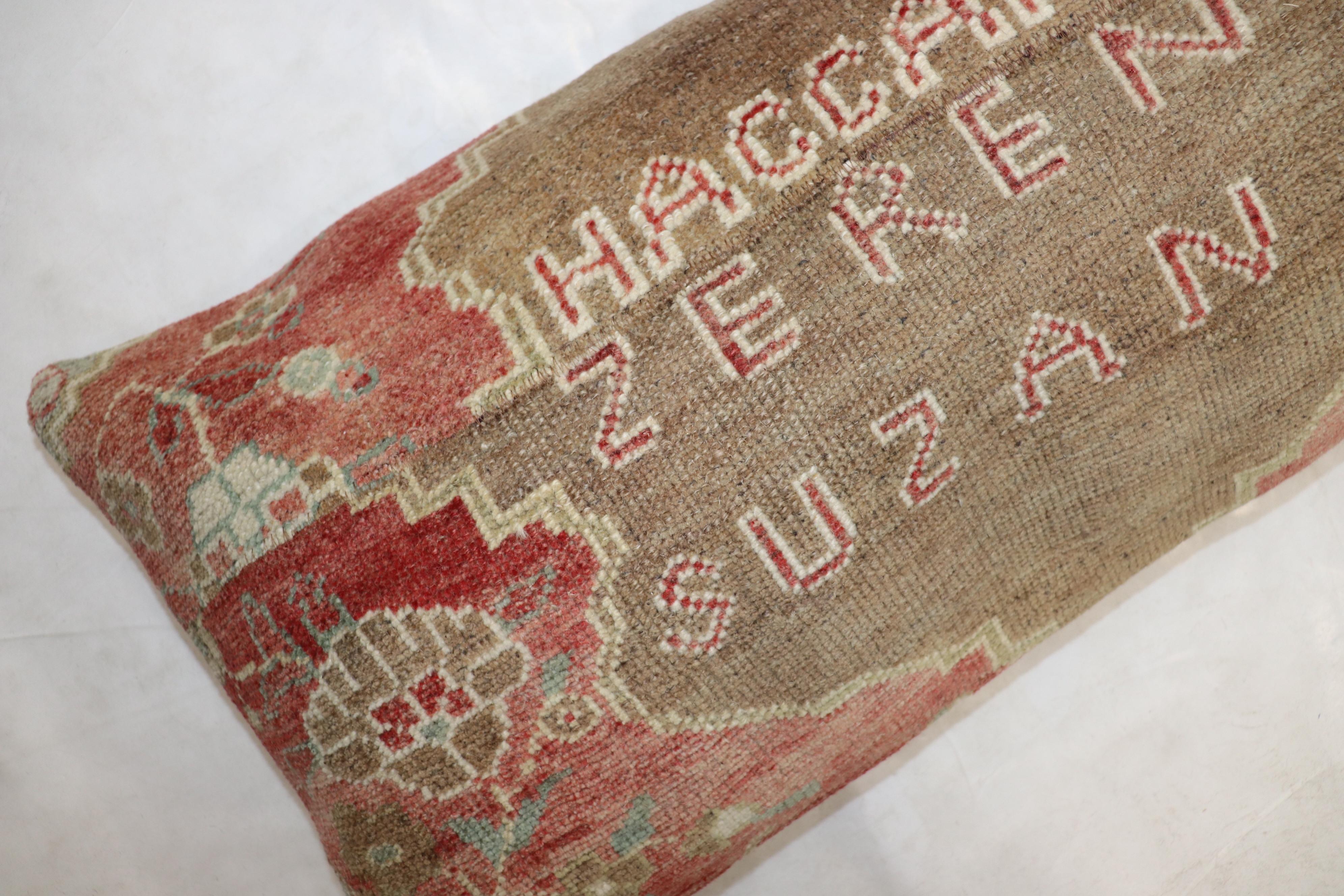 Pillow made from an early 20th-century Turkish rug in brown and soft red with the name 2 first names and last name of a Turkish couple. probably given as a dowry gift

Measures: 15