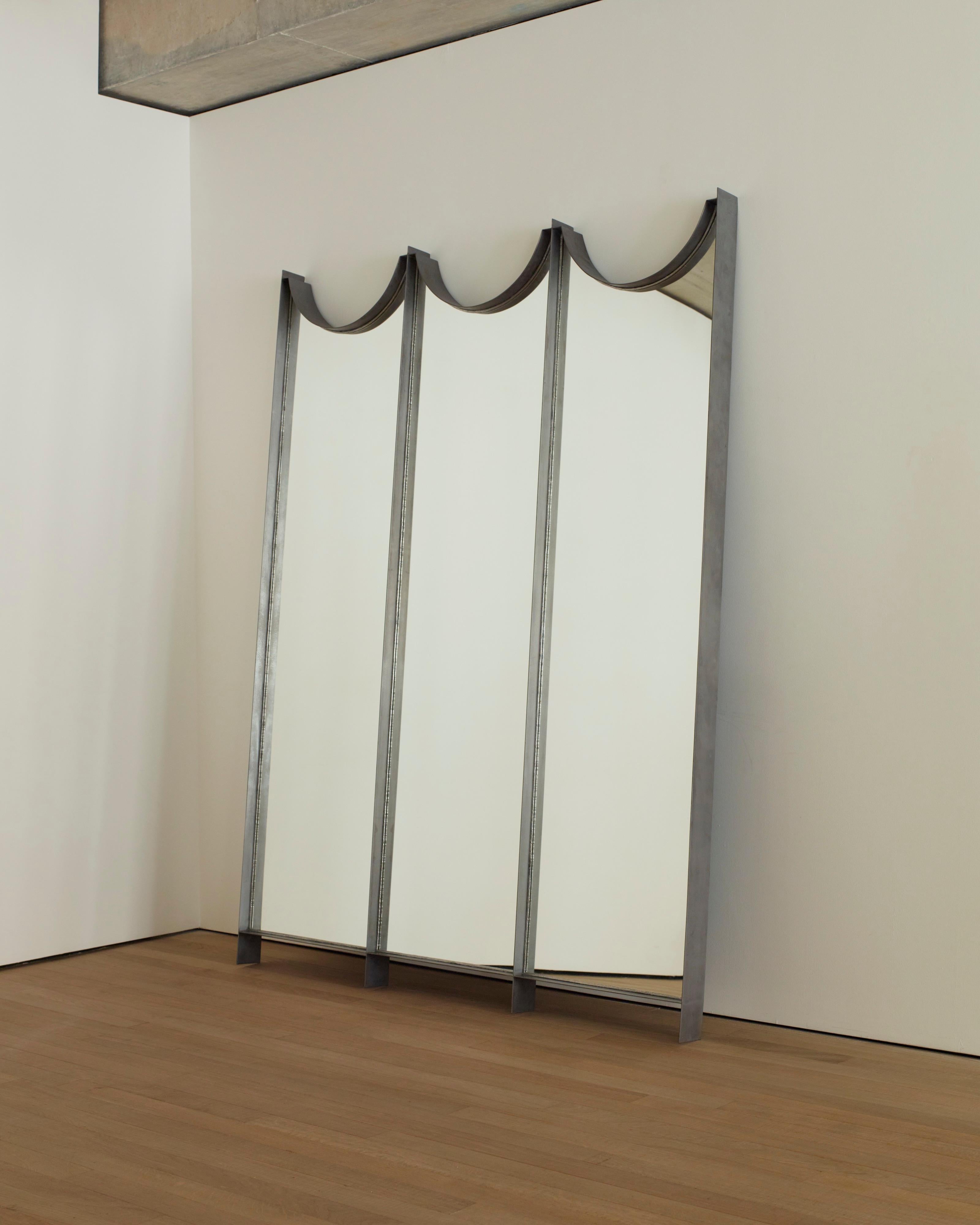 Entitled “Triple Talisman Mirror,” by renowned Paris/Tbilisi-based designers Rooms Studio, this 3-panel, full-length mirror is statuesque in presence and commanding in character. Whether wall-mounted or positioned on the floor, leaning against a