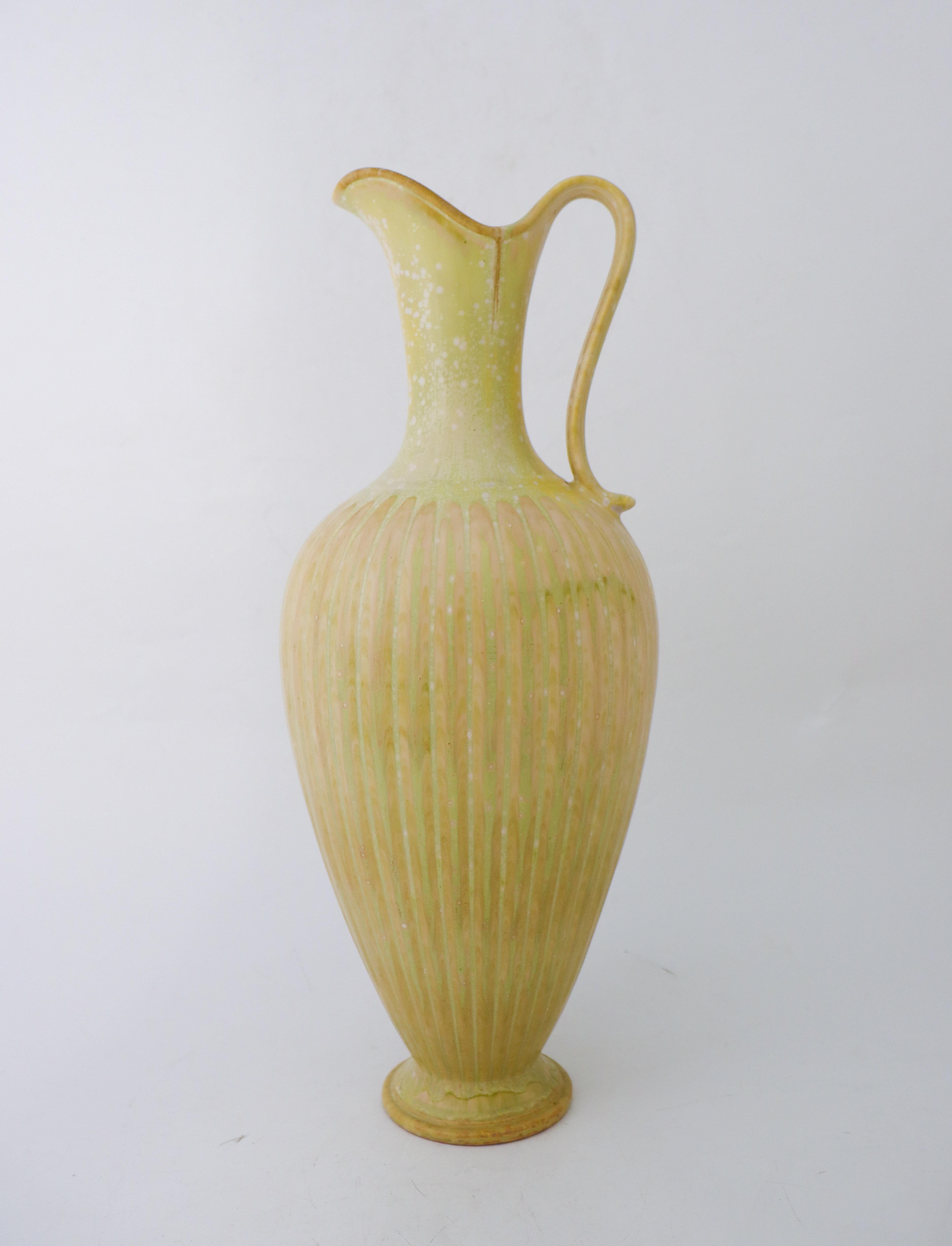 A large floor vase with handle with a lovely green speckled glaze designed by Gunnar Nylund at Rörstrand, it´s 45 cm (18