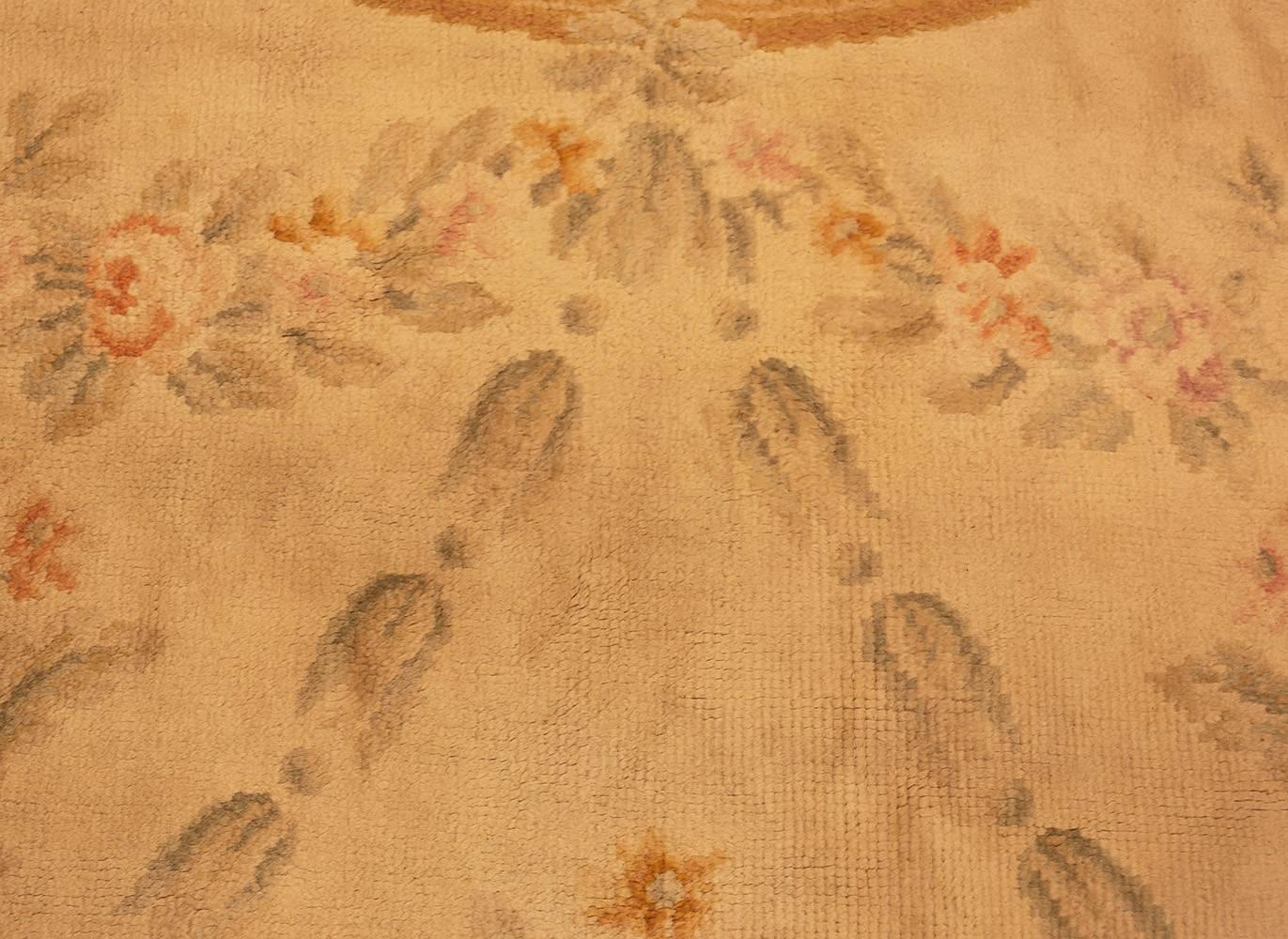 Large size floral antique French Savonnerie carpet, country of origin: France, date circa, late 19th century. Size: 14 ft x 17 ft (4.27 m x 5.18 m)

Delicate medallions are one of the most defining features of the soft and decorative antique