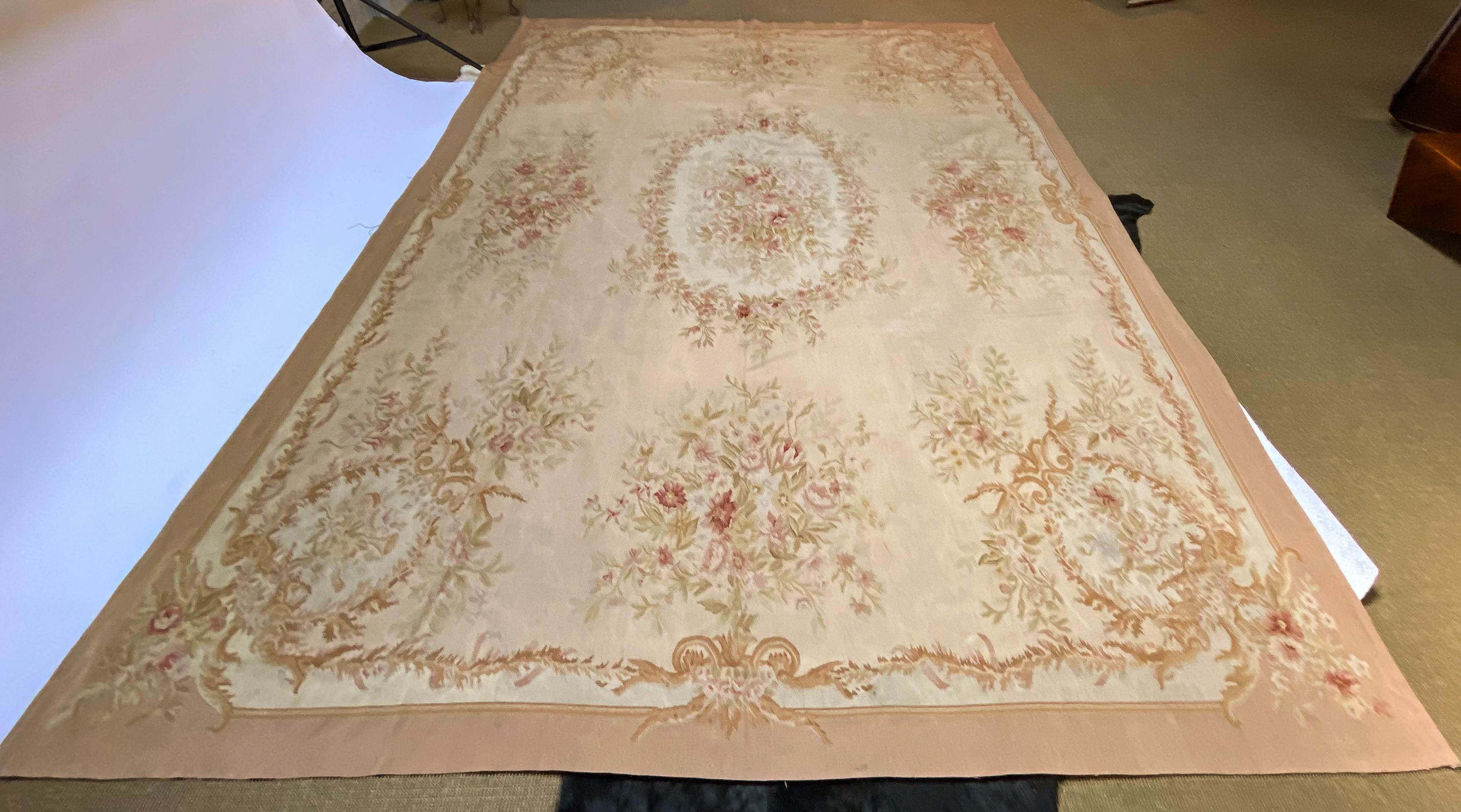 Large Aubusson rug from the 1960s, traditional style with apricot border and floral detail and gold scrolling. 