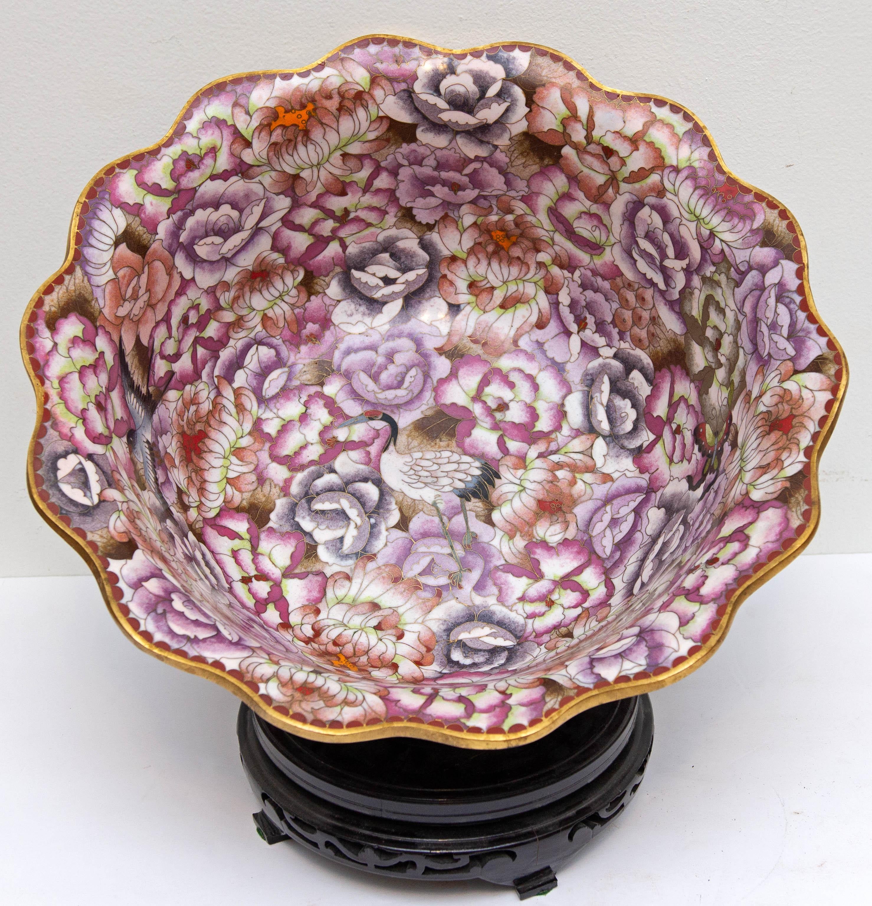 Large floral cloisonné gilt metal center bowl. Decorated interior and exterior. Pinks, marron, and blue flowers. With stand, circa mid-20th century. Measures: 15 1/4