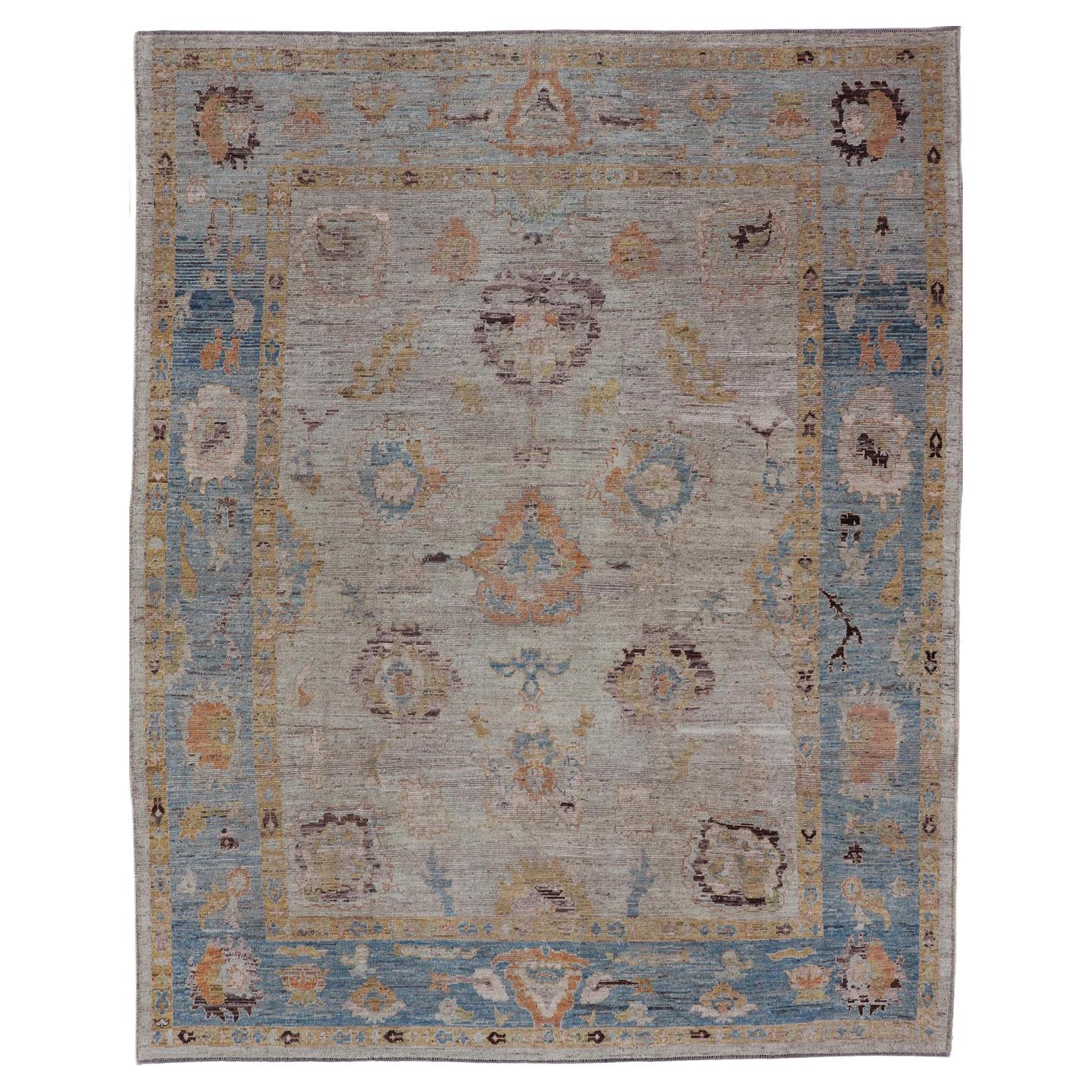 Large Floral Designed Modern Oushak on a Cream Field and Light Blue Border  For Sale