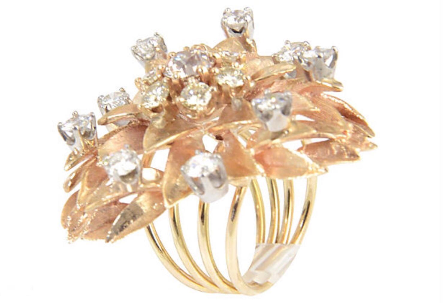 Large 1950s floral ring with over 2.50 carats in diamonds mounted in 14K yellow gold.  The ornament measures  1.30