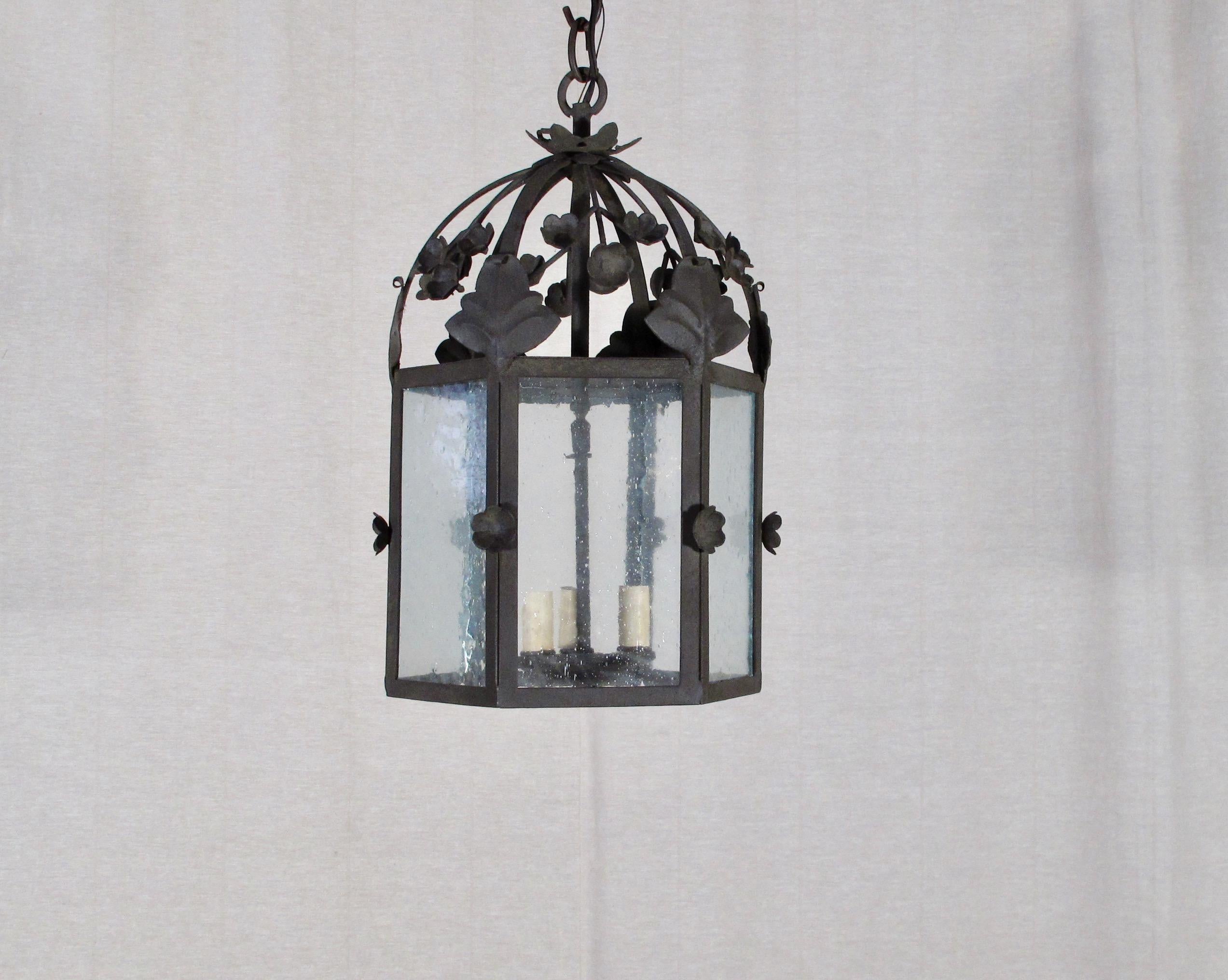 Part of the Chandelier Product Line, this is our floral lantern, Large. This fixture can be used for Interior or Exterior use and is UL Listed. 3' chain included. Three candelabra base bulbs up to 60 watts/socket. Also available in small size. This