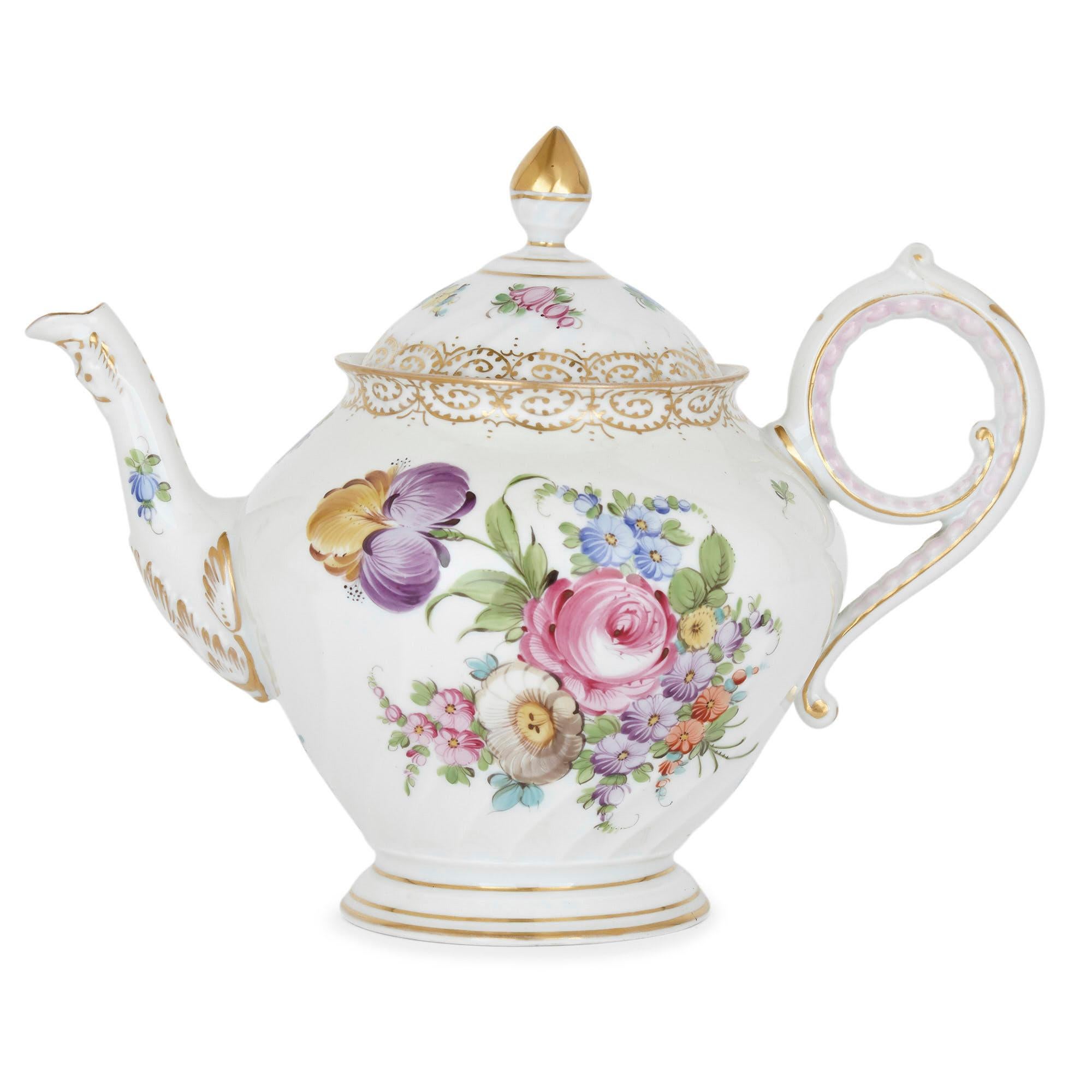 Large floral porcelain dessert service by Dresden
German, early 20th century
Measures: Teapot height 21cm, width 26cm, depth 18cm
Smallest cup height 6cm, width 7.5cm, depth 6cm

This fine dessert service is a beautiful example of Dresden