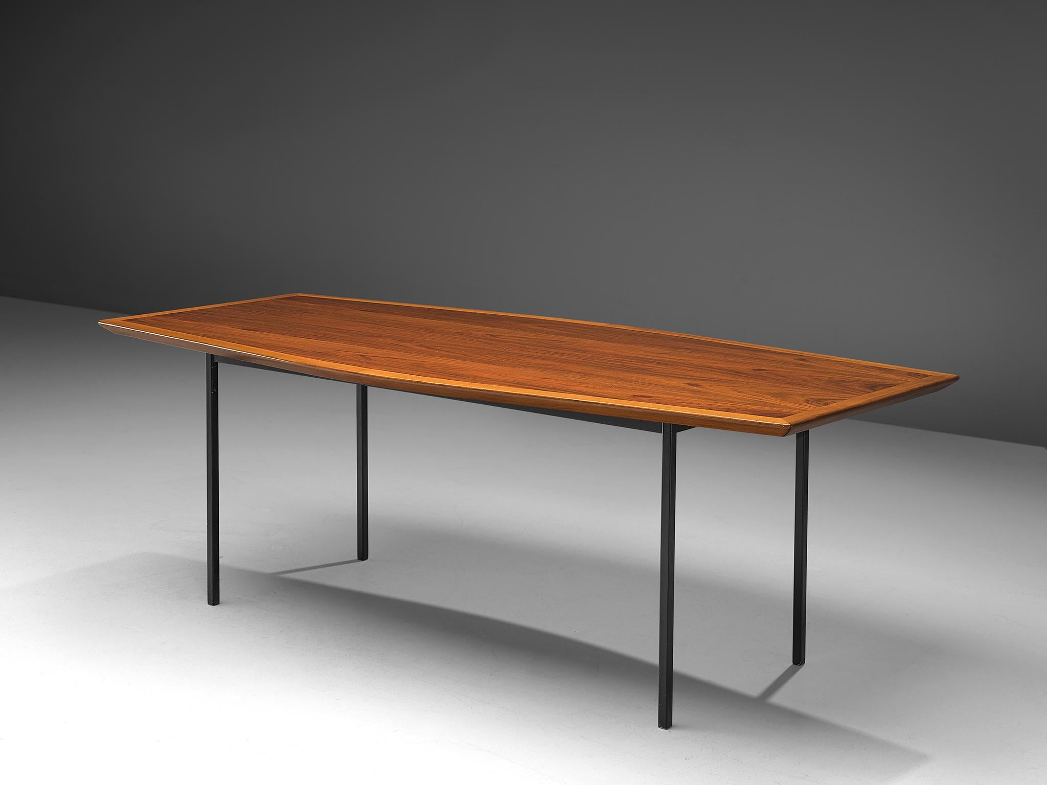 Knoll International, walnut, metal, table model 580, United States, 1958-1976.

Large dining table with boat shaped top in walnut. The table can seat 8 people. The table has four circular legs. The tabletop features a bevelled, edge, made of a