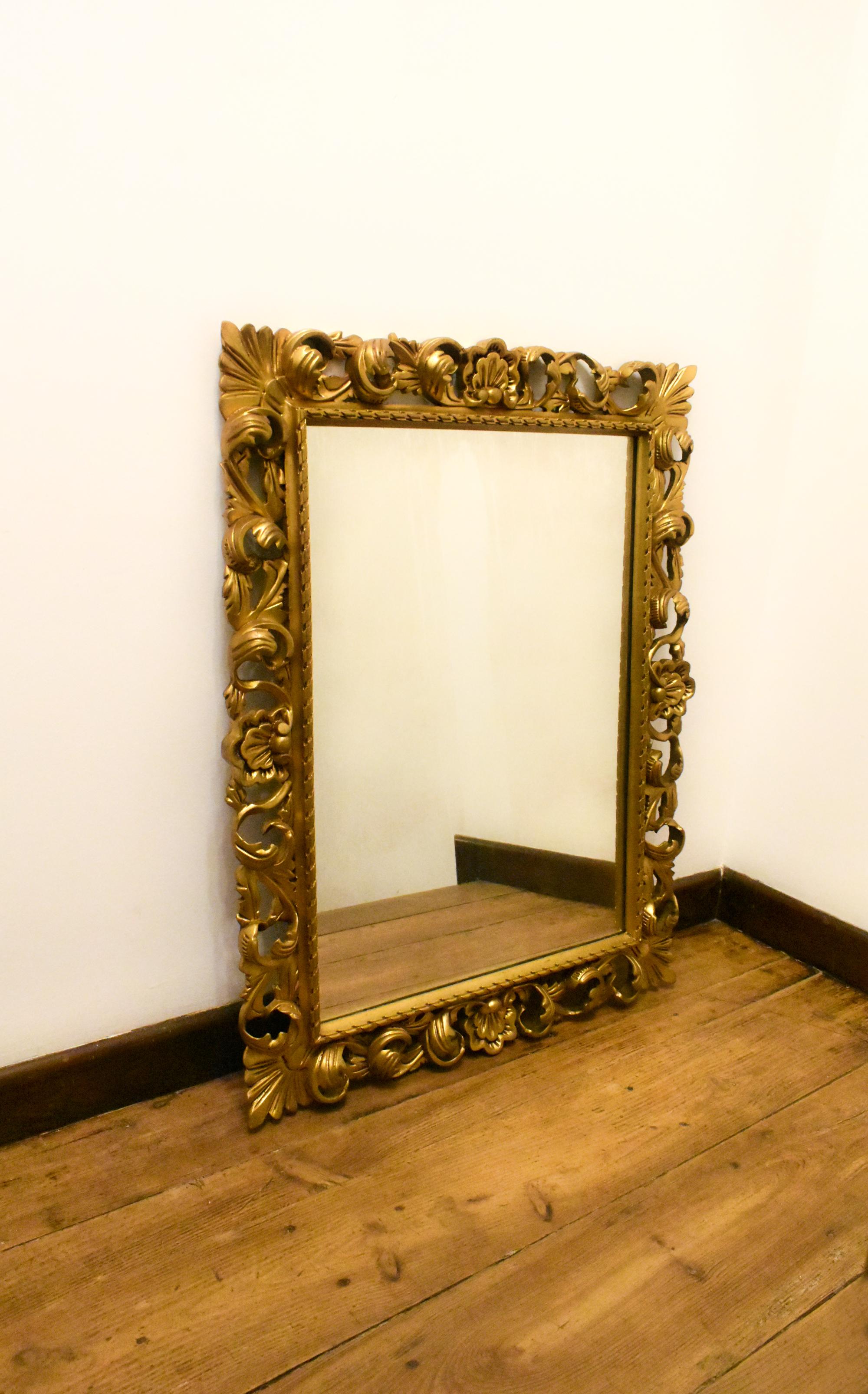 Carved Large Florentine Style Giltwood Wall Mirror For Sale