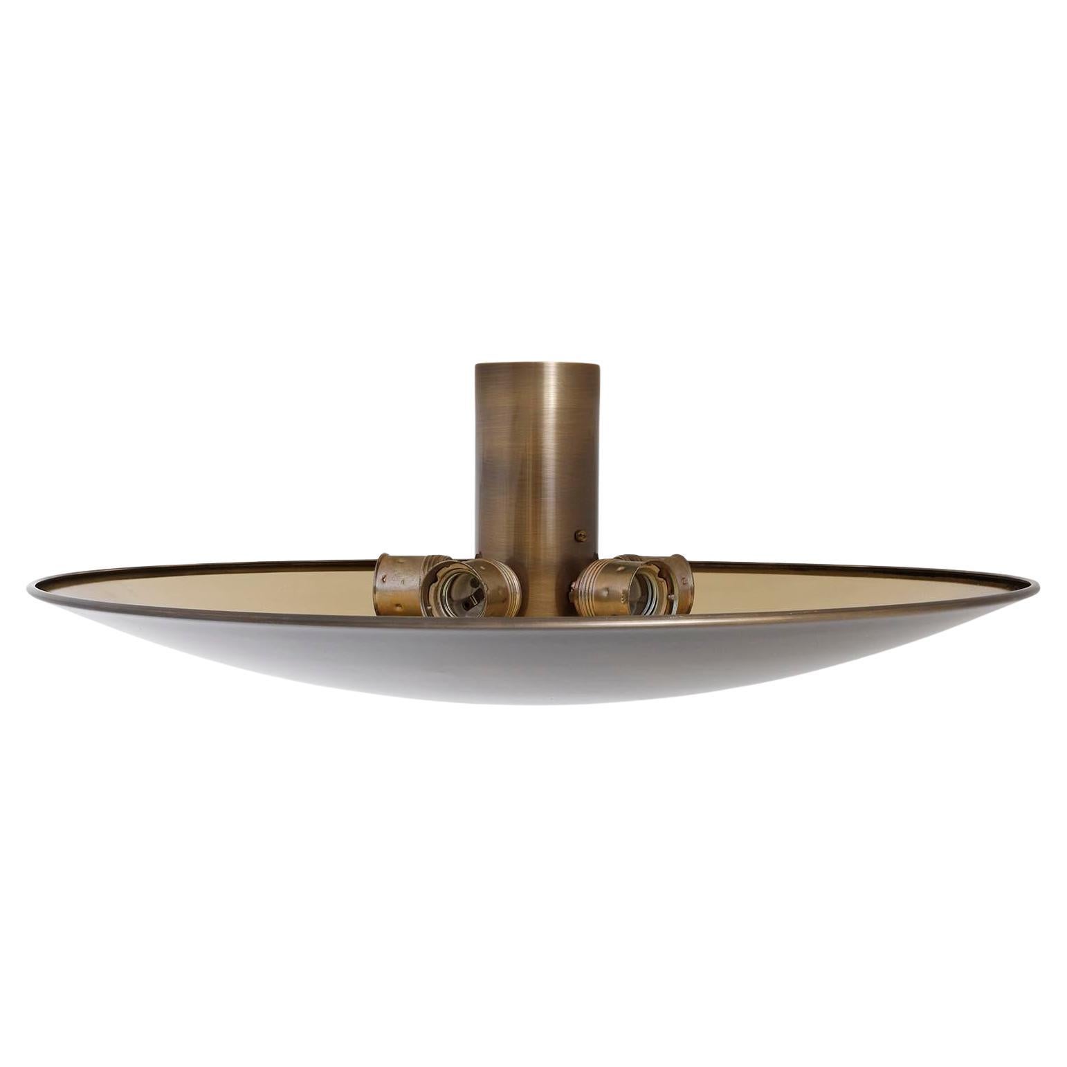 An uplight bowl ceiling light fixture by Florian Schulz, Germany, manufactured in midcentury, circa 1970 (late 1960s or early 1970s). 
The finish is custoimzed. The inner side of the solid brass uplighter is polished and the outer side is