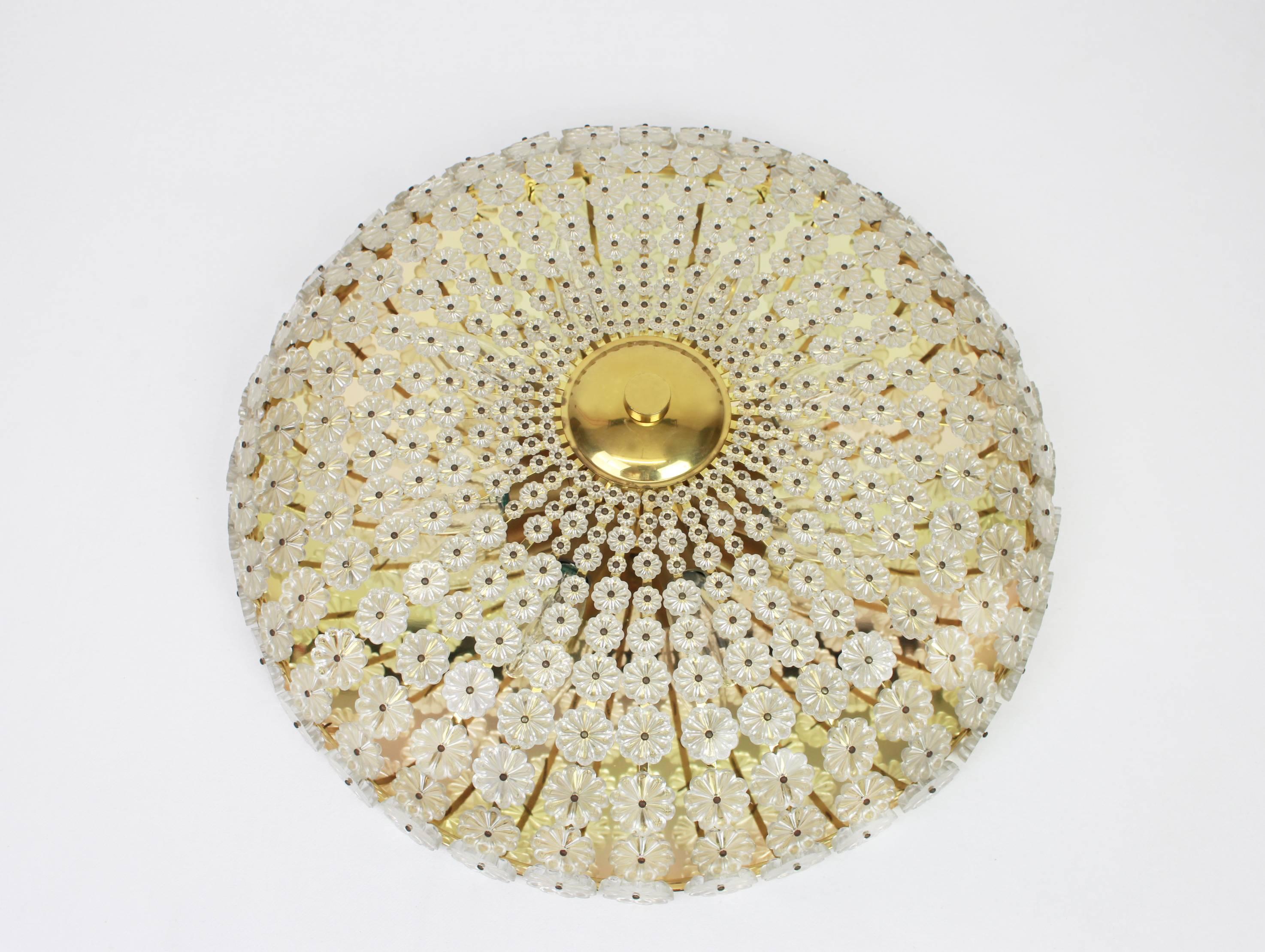 Large flower shaped flush mount designed by Emil Stejnar in Austria, 1960s.
It features a brass frame with hundreds of crystal glasses surrounding the frame creating a spectacular flower form design.

High quality and in very good condition.