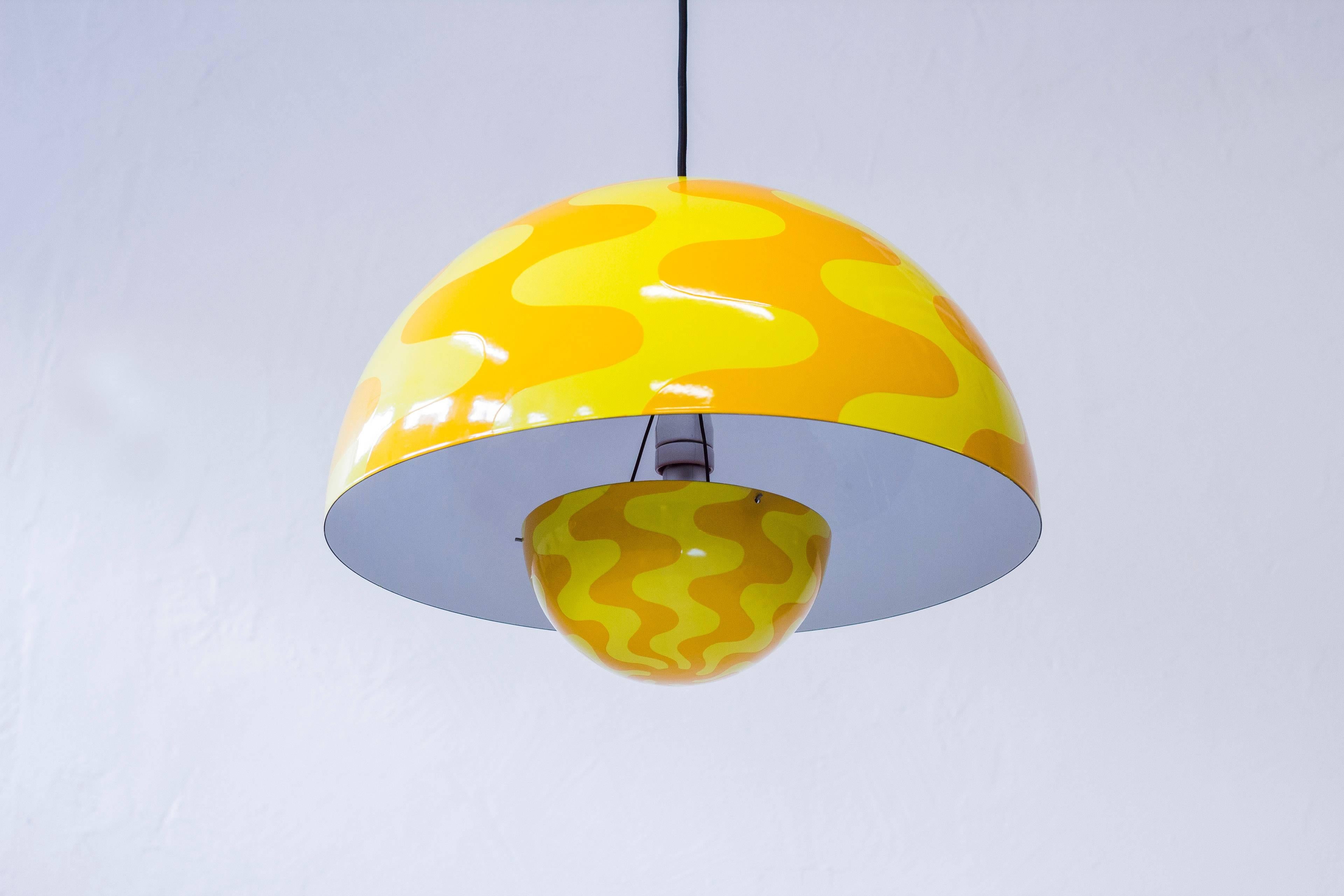 Rare large flower pot ceiling lamp designed by Verner Panton. Produced by Louis Poulsen in the early 1970s. Made from enameled steel with two tones of yellow on the outside and white and red enamel on the inside. All original with only exchanged
