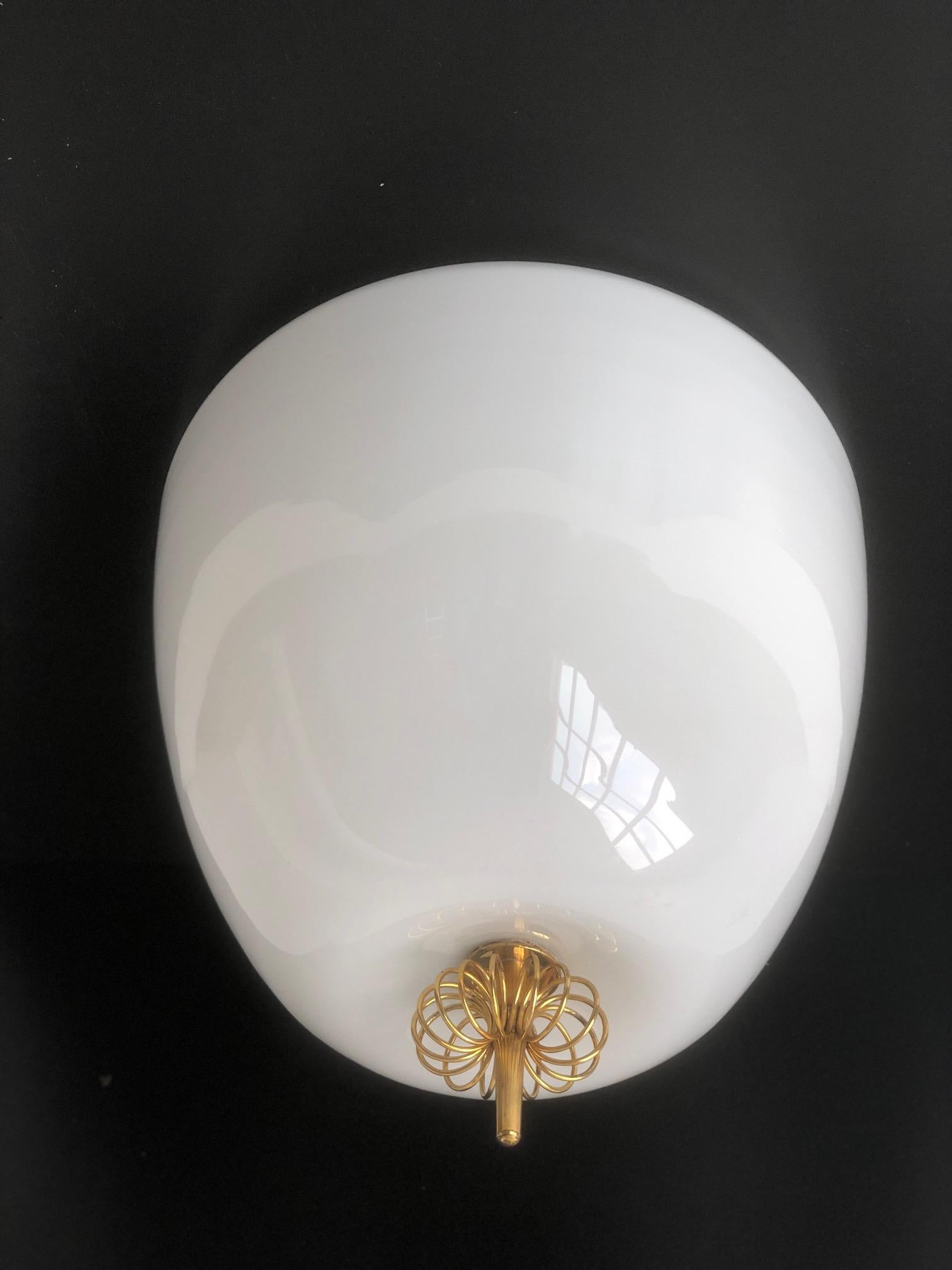Flush mount  lamp designed by Gunnel Nyman for Idman, Finland. Circa 1950th. Opaline glass with brass decor. Stamped 
