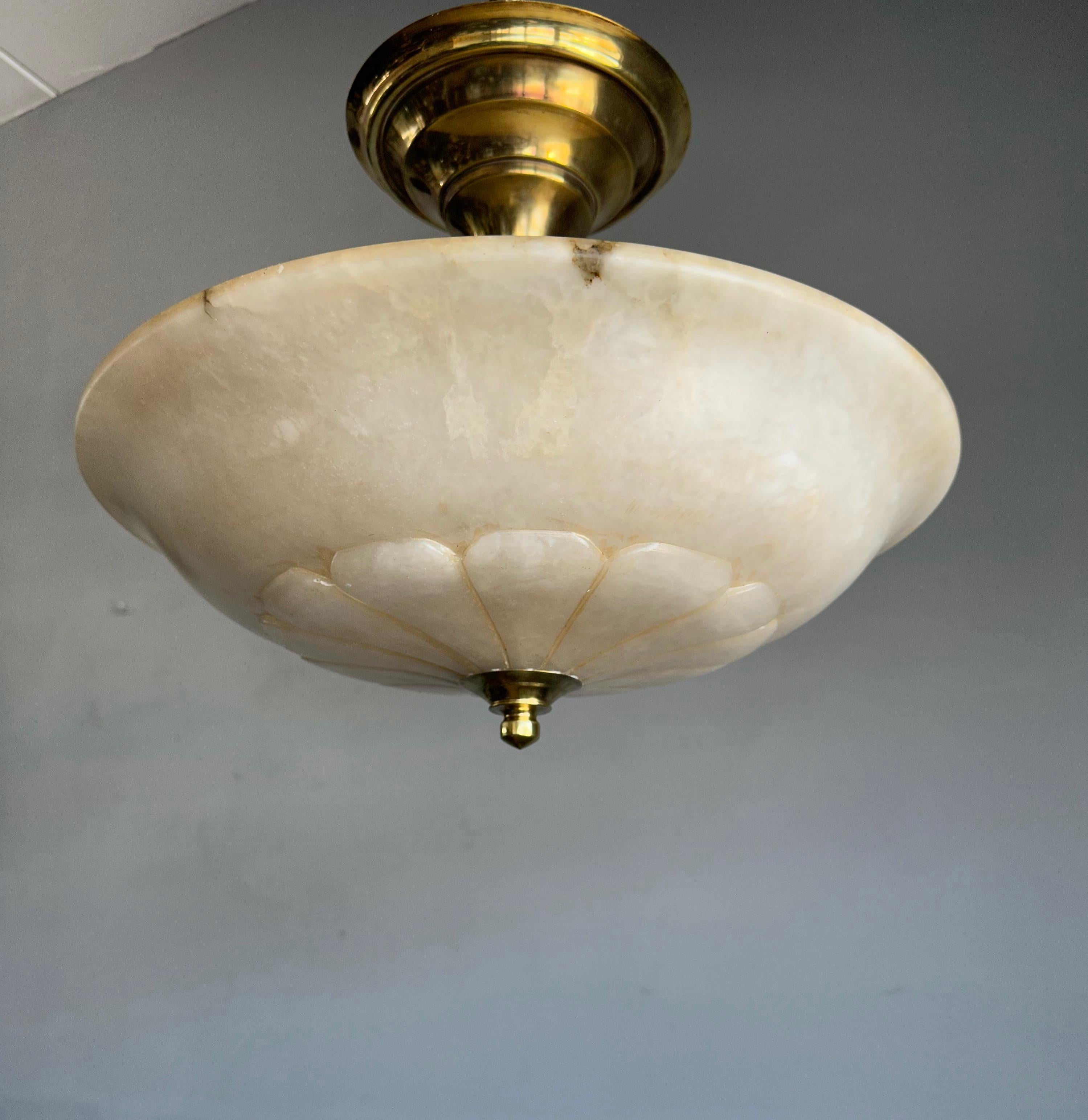 Rare and majestic, three light alabaster pendant.

This large size flush mount comes with a stunning design and perfectly polished alabaster shade. This beautifully balanced alabaster light fixture is designed in such a way that the three bulbs