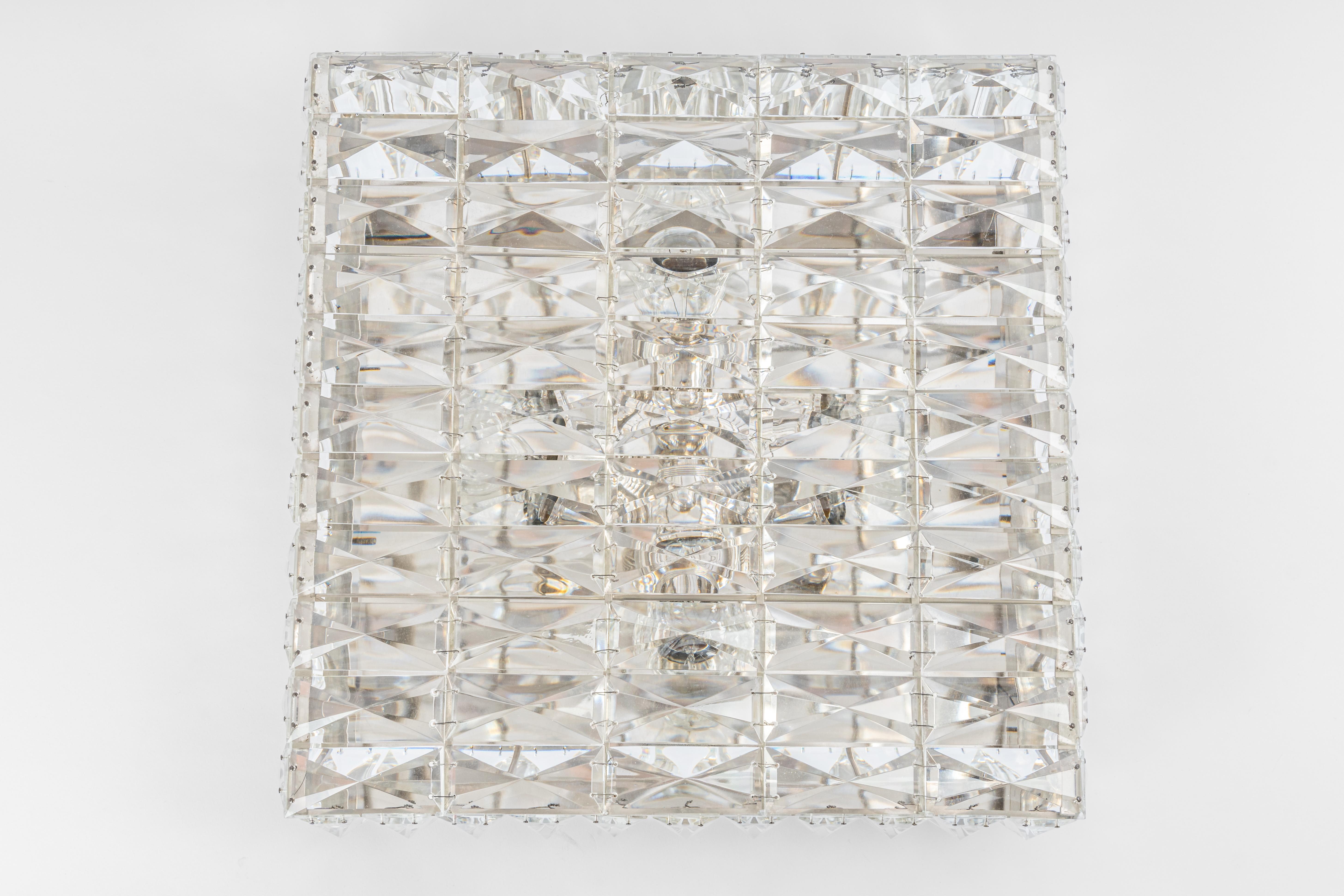 Wonderful light fixture in style of Kinkeldey, Germany, manufactured in circa 1960-1969. The fixture is made of a metal frame with many facetted crystal glass elements.
Measures: Width 16.9 in /43 cm
Height 5.5 in / 14 cm

Sockets: 4 x E27 standard