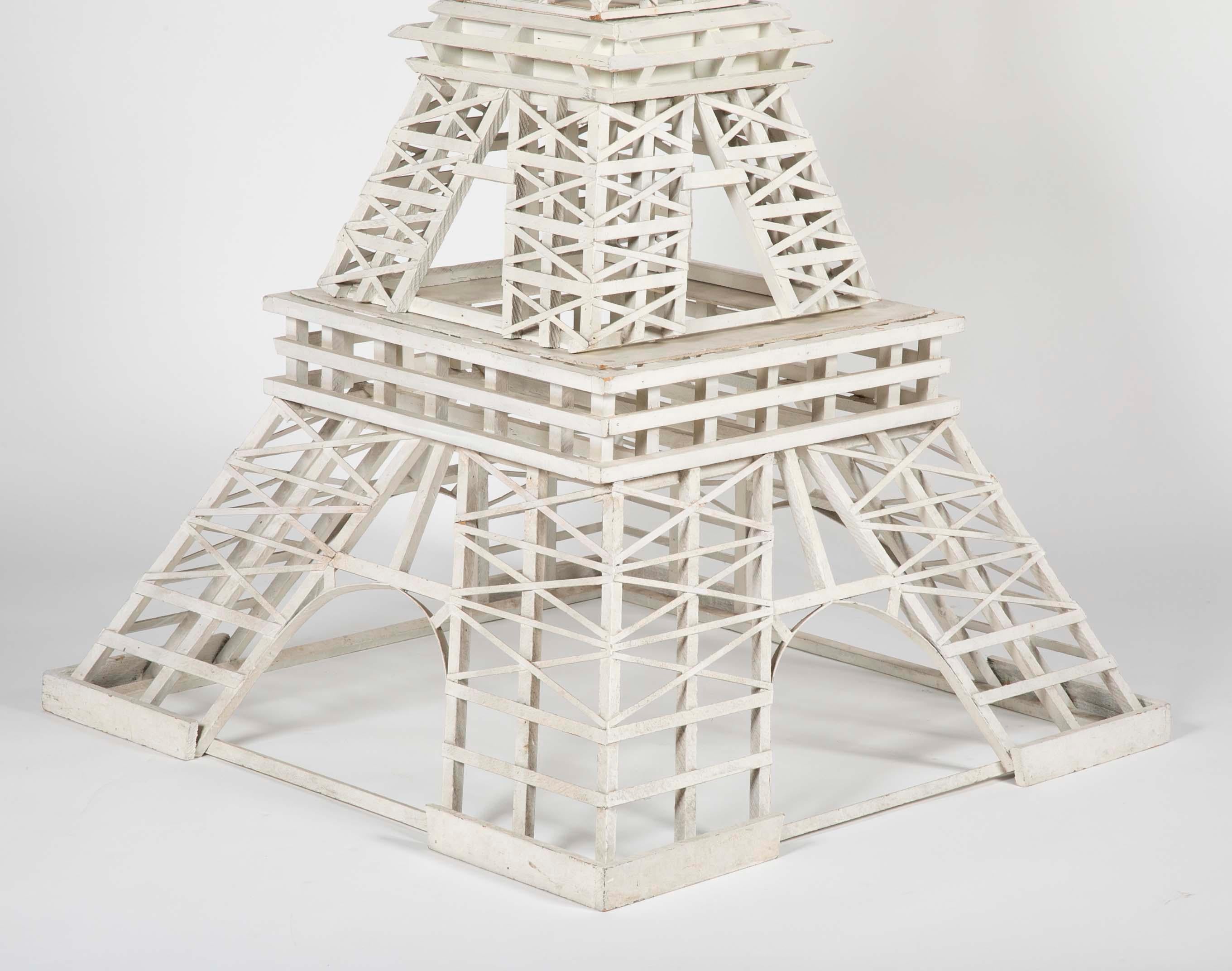 Large Folk Art model Eiffel tower. Created by Matthew M. Orante using 783 pieces of wood. Model accompanied by original newspaper article.
