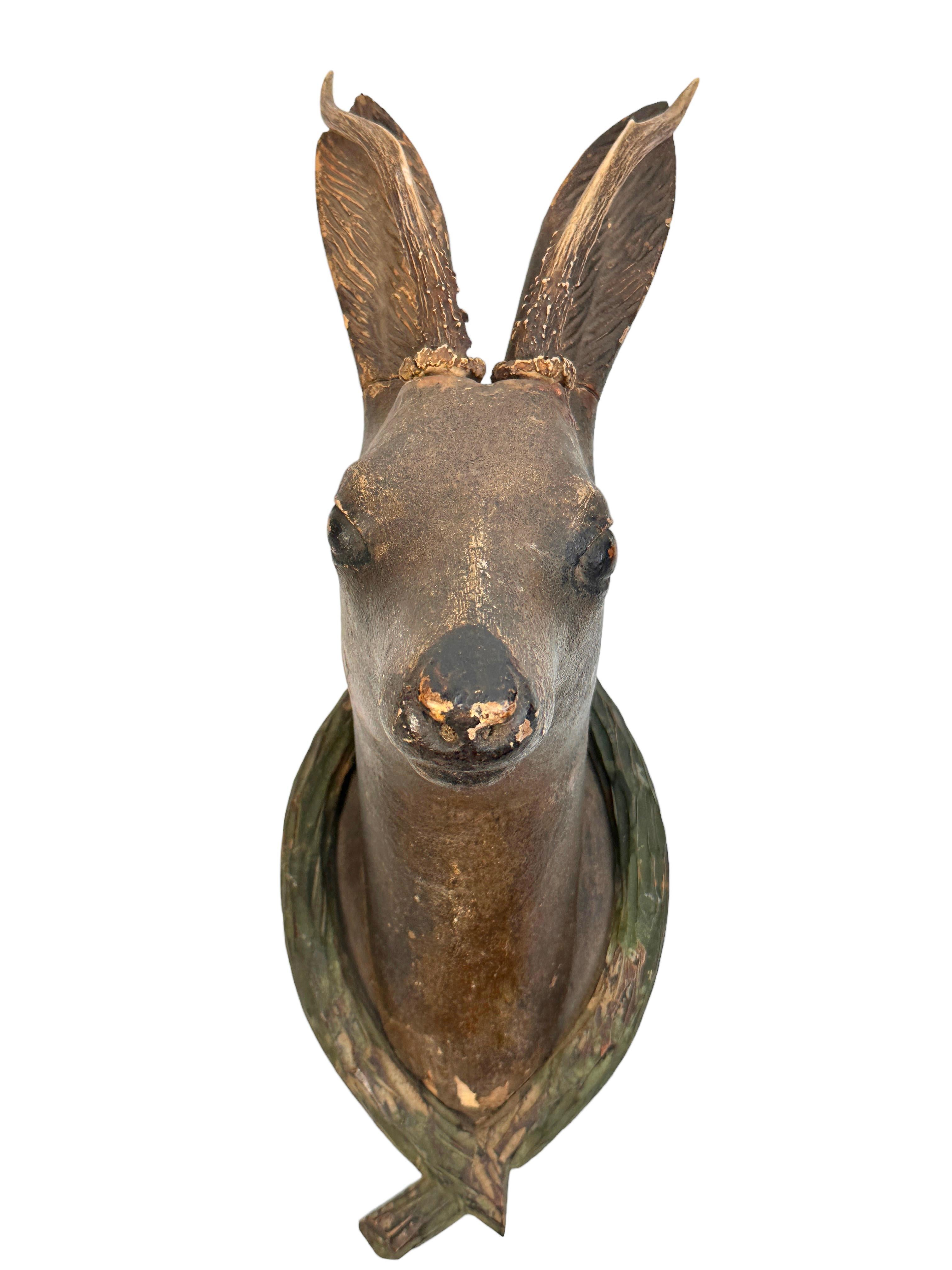 A great looking hand carved original wooden Folk Art deer head wall decoration. A great piece for a suitable ambiance in a trophy room or the office of a Hunter or Woodsman. More than likely one of the Folk Art items made between 1860 and the late