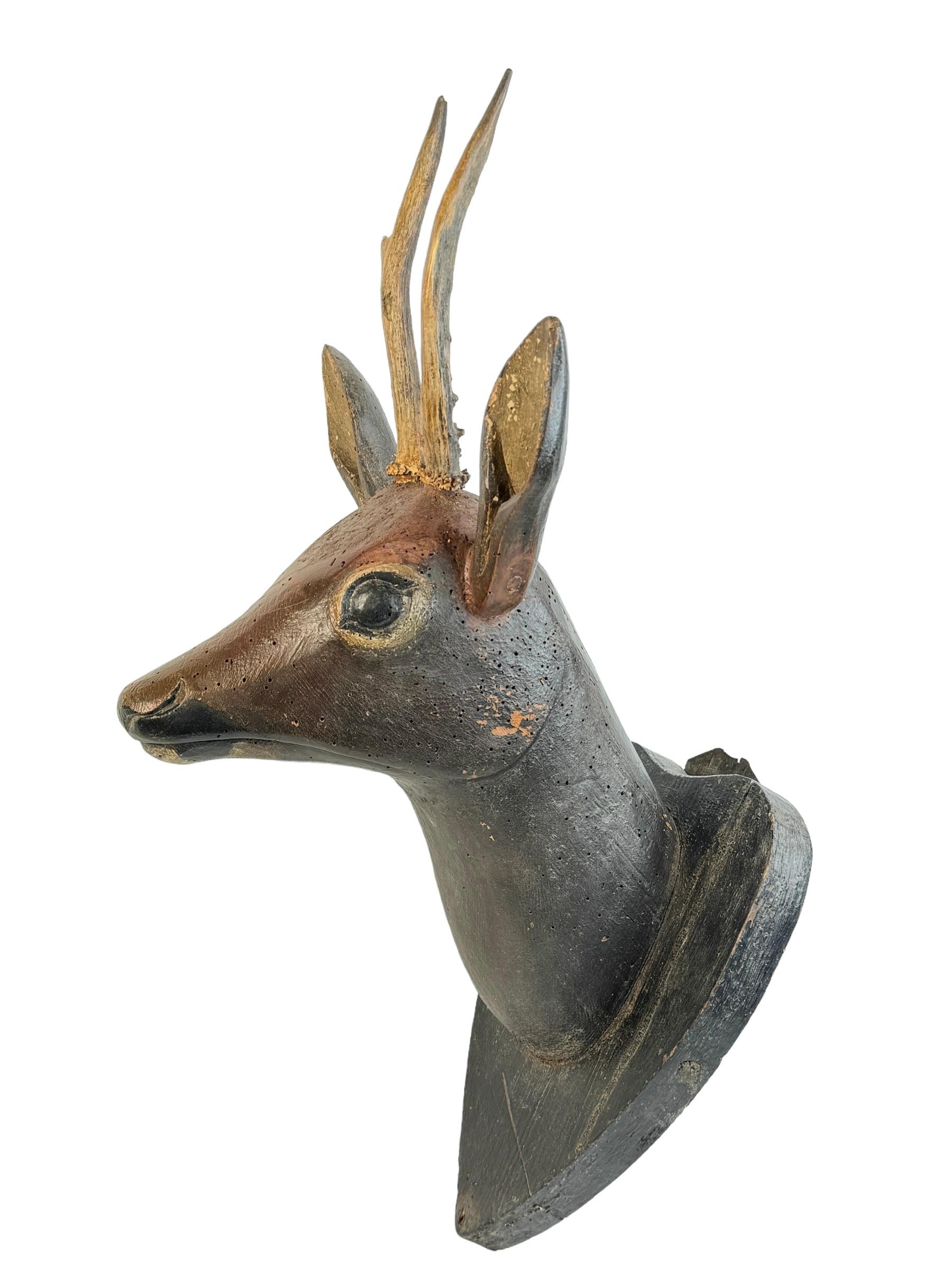 A great looking hand carved original wooden Folk Art deer head wall decoration. A great piece for a suitable ambiance in a trophy room or the office of a Hunter or Woodsman. More than likely one of the Folk Art items made between 1860 and the late