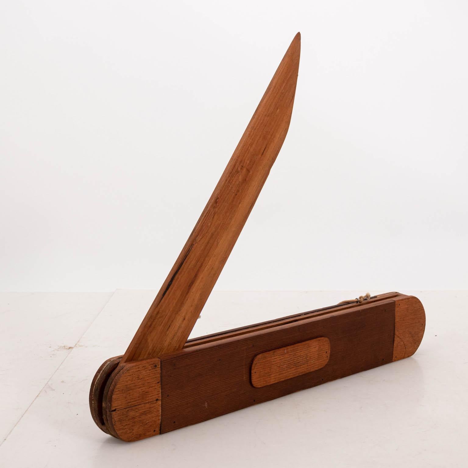 Large Folk Art pocket knife store display made of mixed wood, circa 1950s. The piece closes and opens as well. Please note of wear consistent with age including minor wood loss and chips.