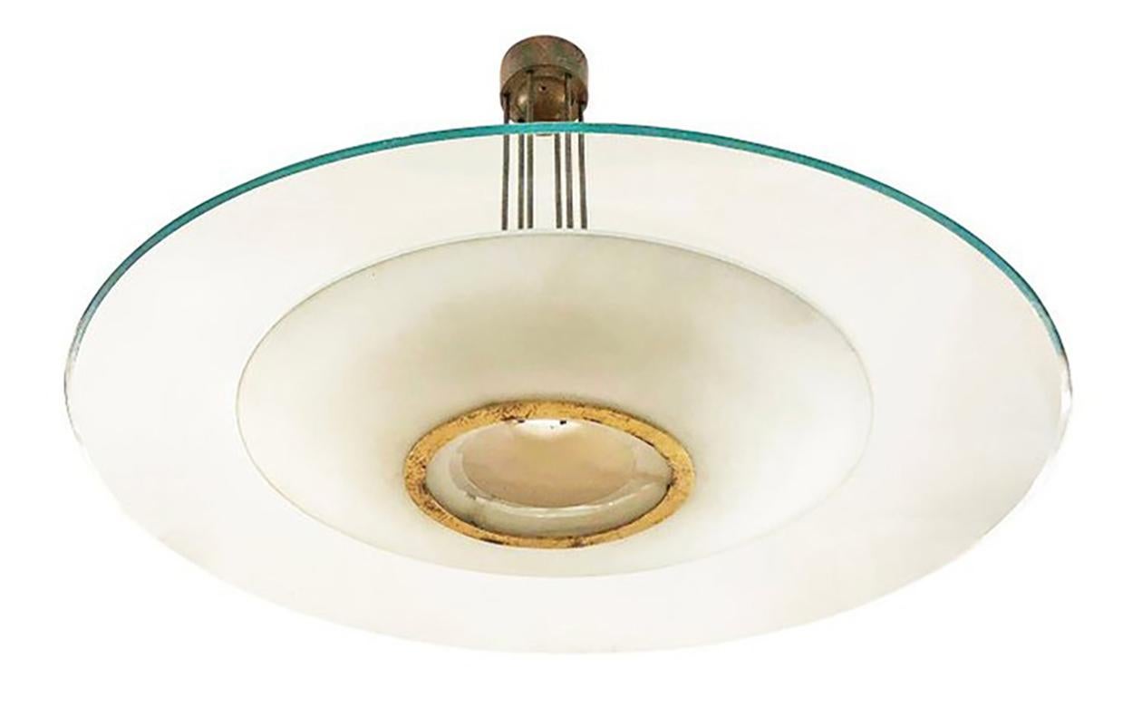 Very large Fontana Arte ceiling light model 1498 designed by Max Ingrand in the late 1950s. Features a lower frosted glass shade and an upper lightly tinted transparent glass shade. Brass hardware. Holds fifteen candelabra bulbs.

Condition: This