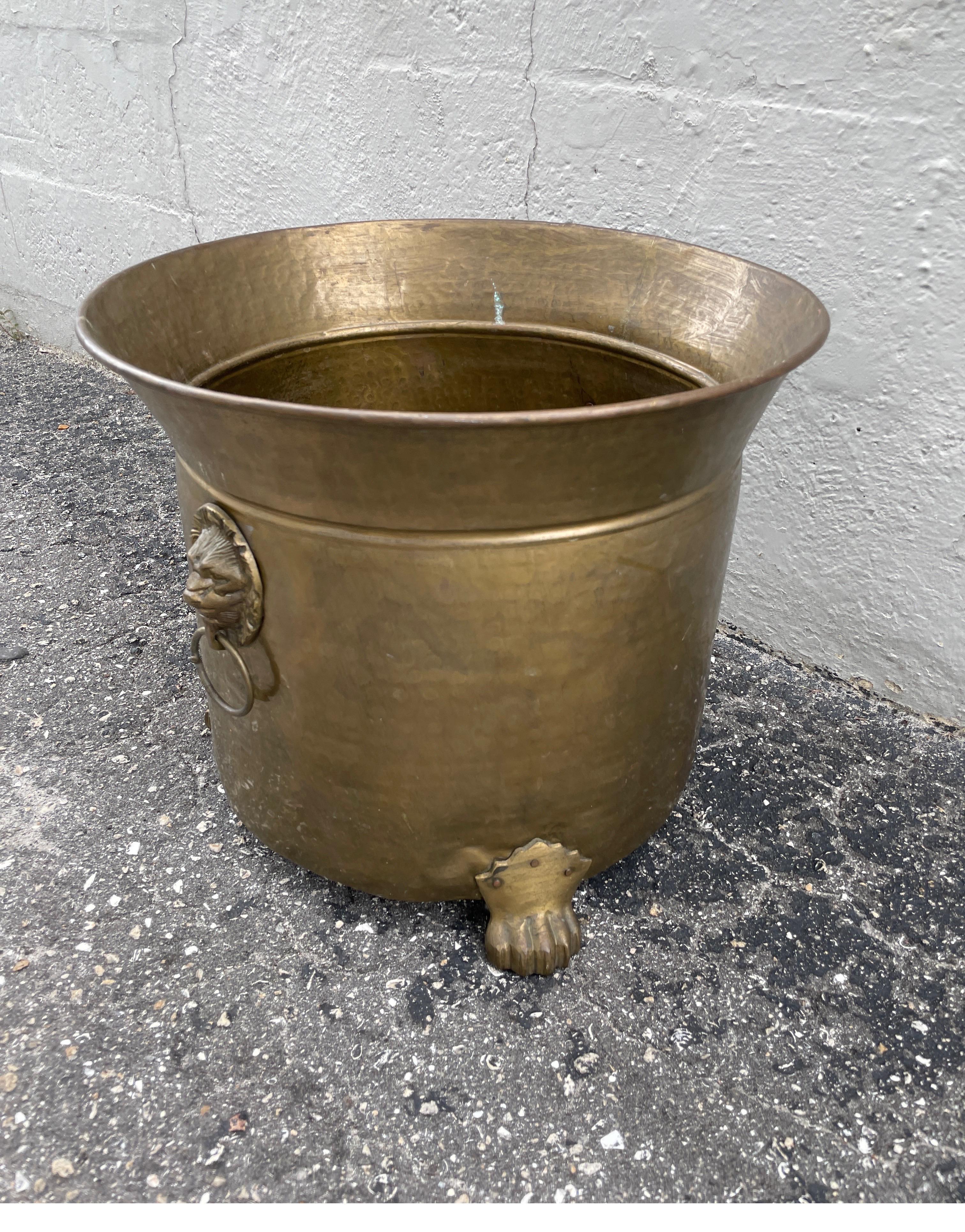 Vintage brass planter with paw feet & lion head ring handles. Beautiful original patina.
