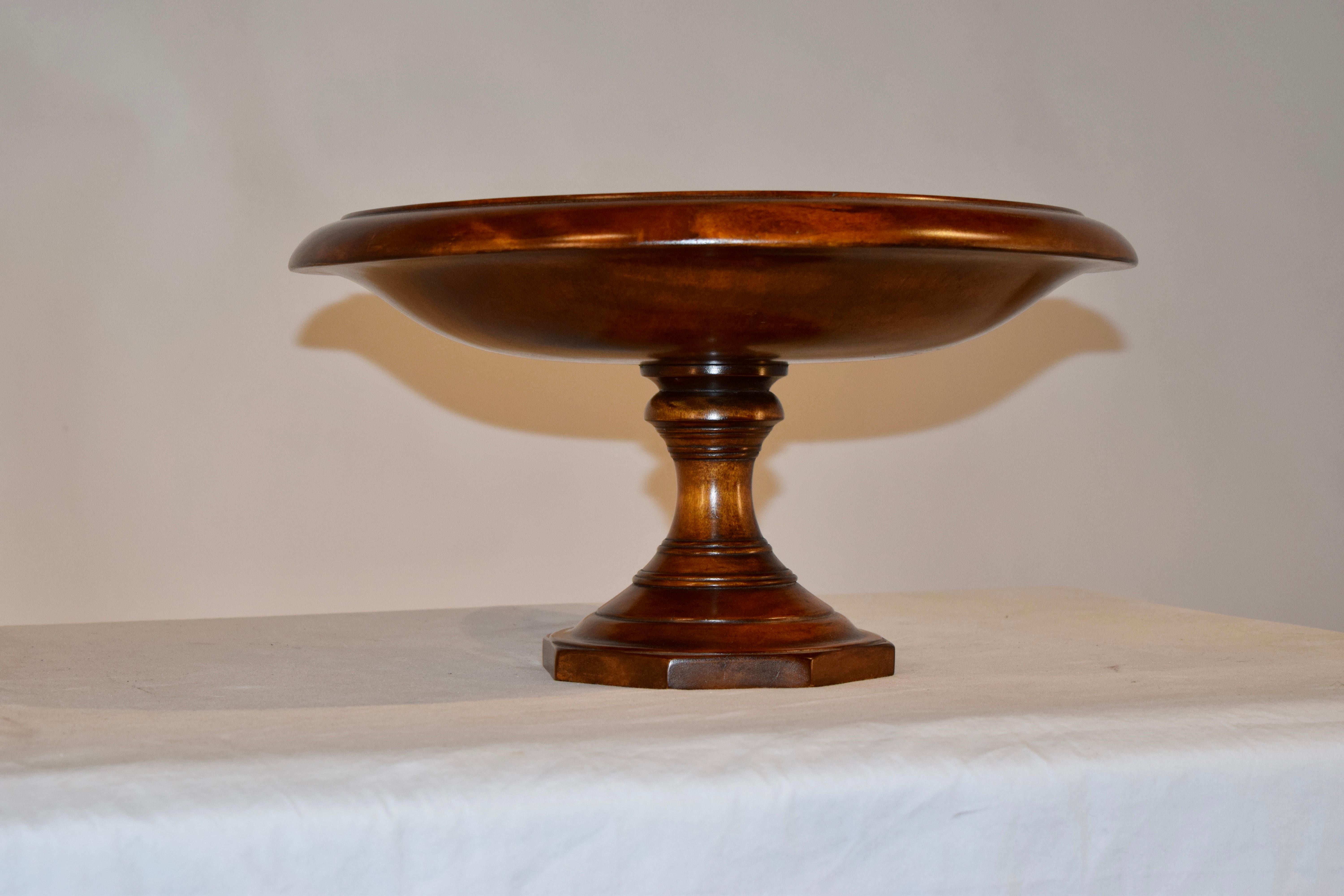English footed large bowl made from mahogany, circa 1900. The bowl is nicely hand turned and is supported on a turned pedestal with an octagonal shaped base.