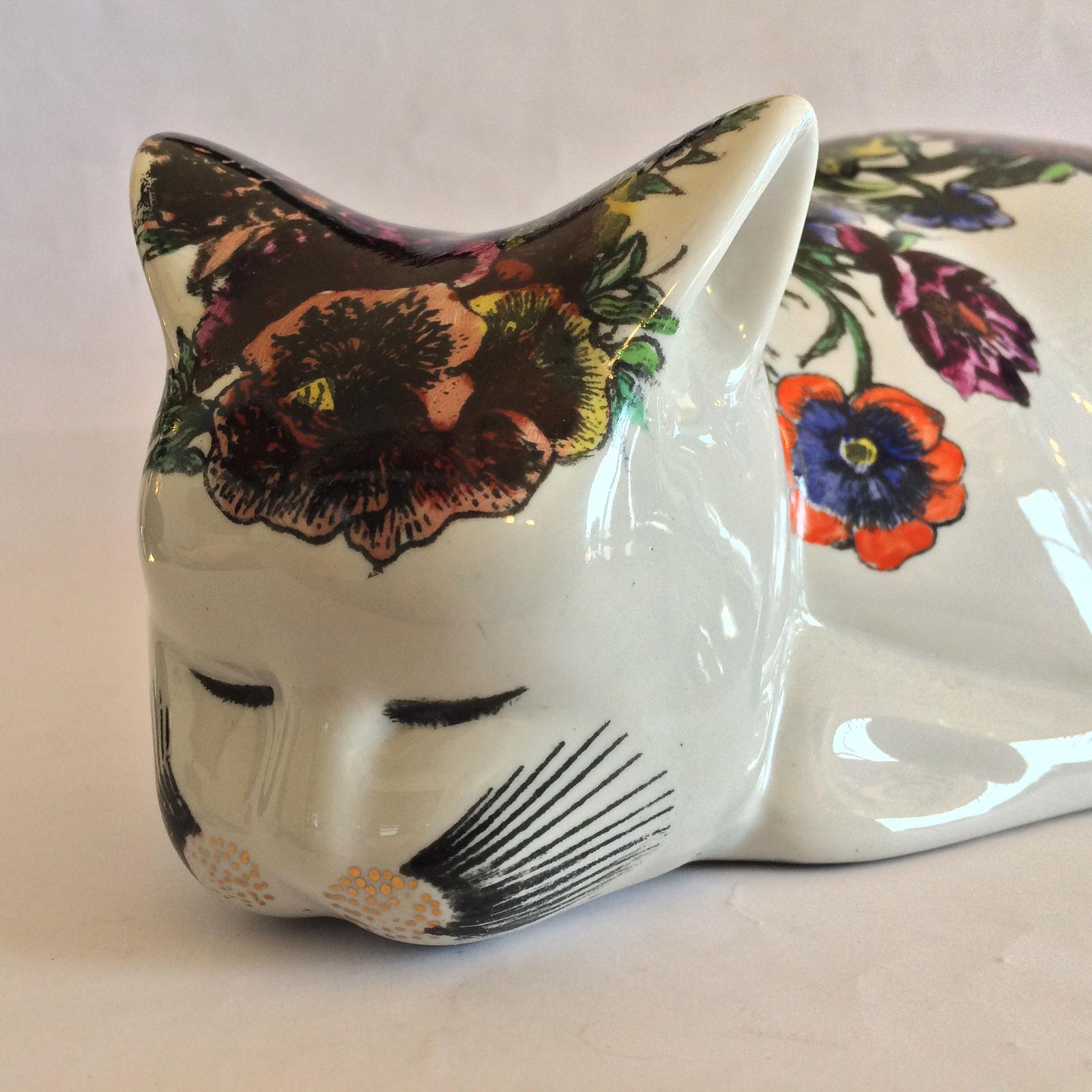Midcentury rare large white cat by Piero Fornasetti. To the base, is the ”Artist’s hand with brush”, within a star pointed circle, with “FORNASETTI MILANO”, followed by “MADE IN ITALY” all around the inner perimeter; also has the gilt script with