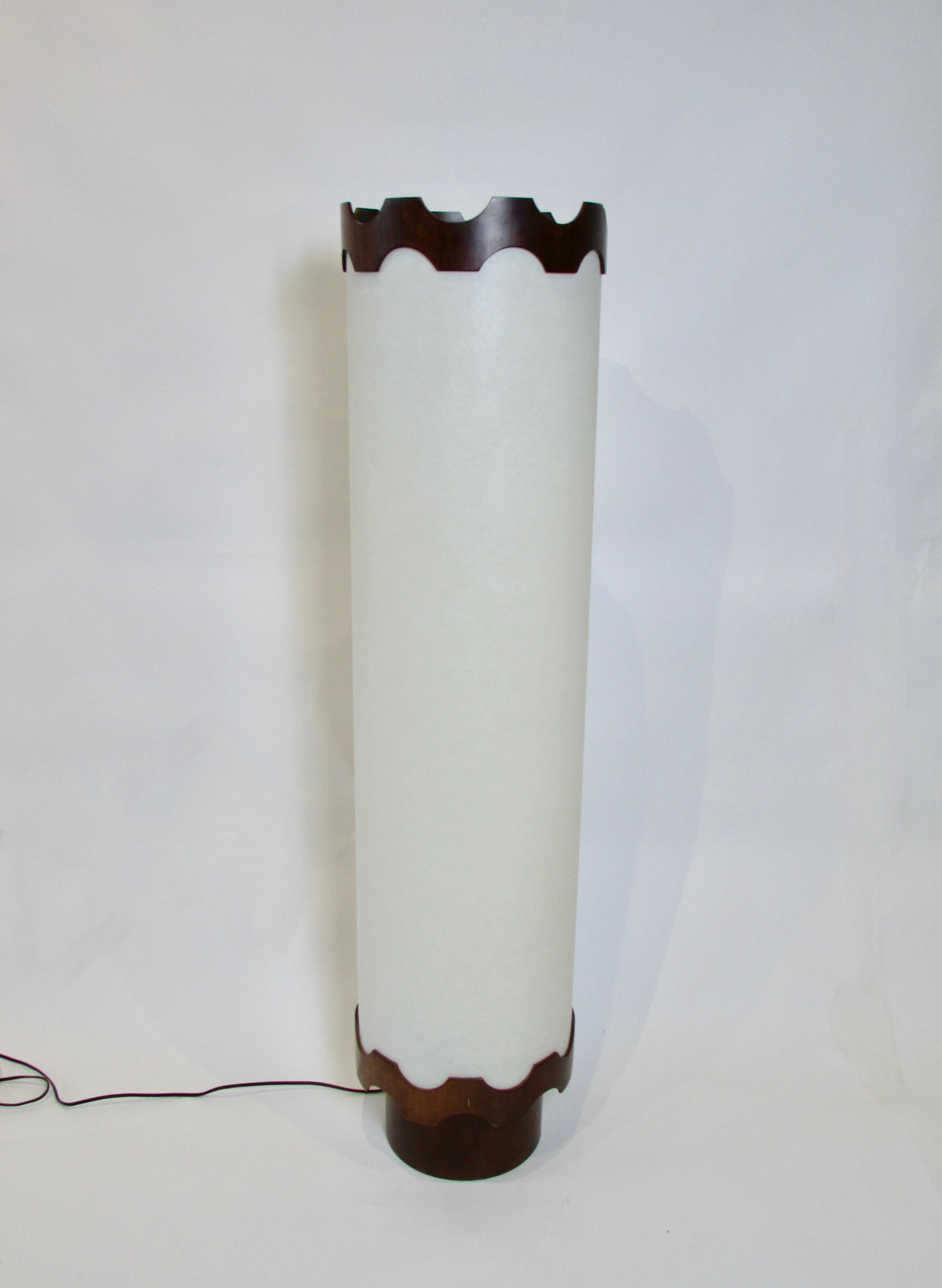 Four foot one inch tall cylinder of soft white accent lighting . Works either as table lamp or double as a floor lamp  . Soft white mood lighting shines through recently restored shade . Restored using period white fiberglass lamp shade material .