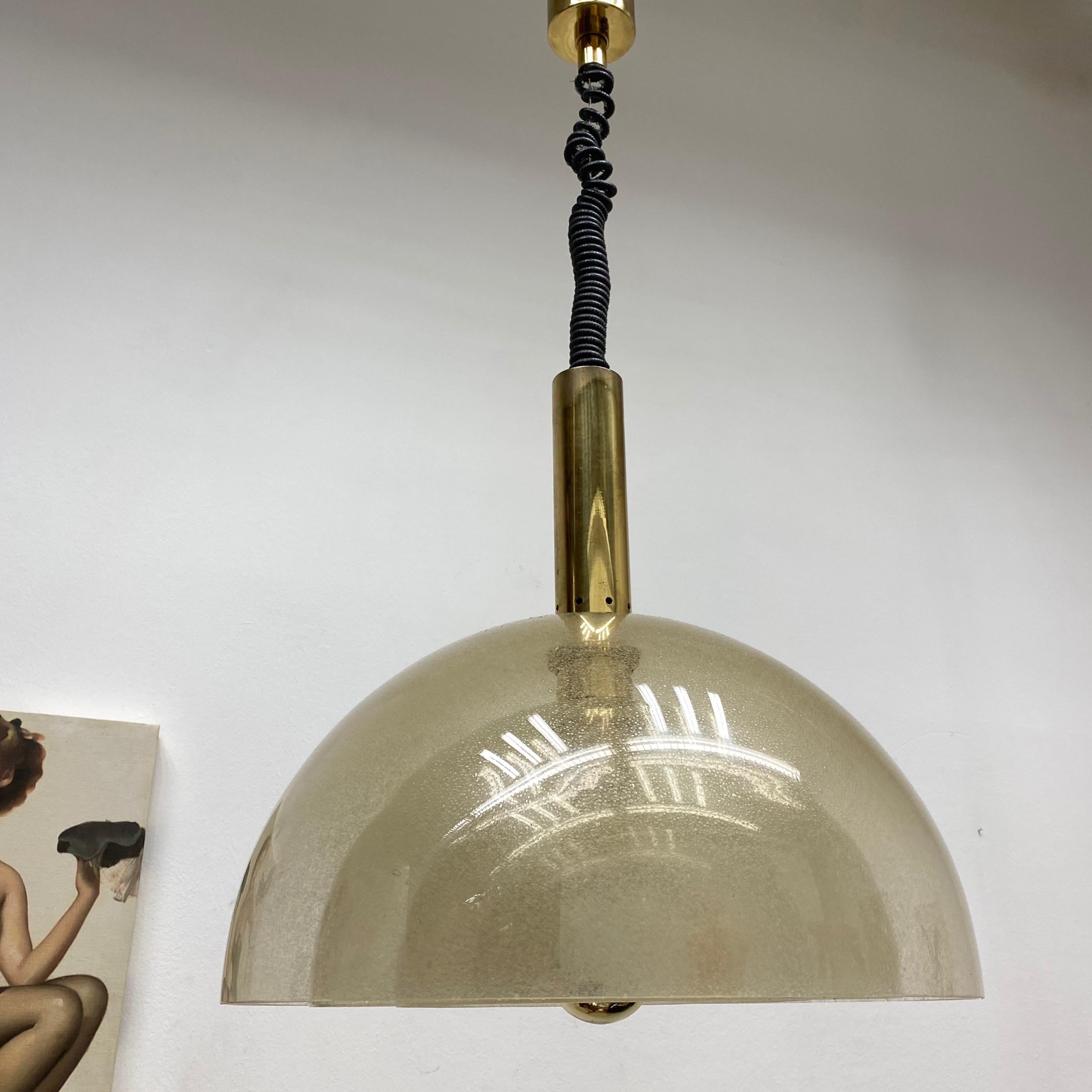 Beautiful four-layer Murano Pulegoso glass pendant lamp by Carlo Nason for Mazzega. Large pendant lamp composed of four-layer Murano glass domes. All attached by a polished brass stem and canopy. Elegant and ingenious designed by Italian master of