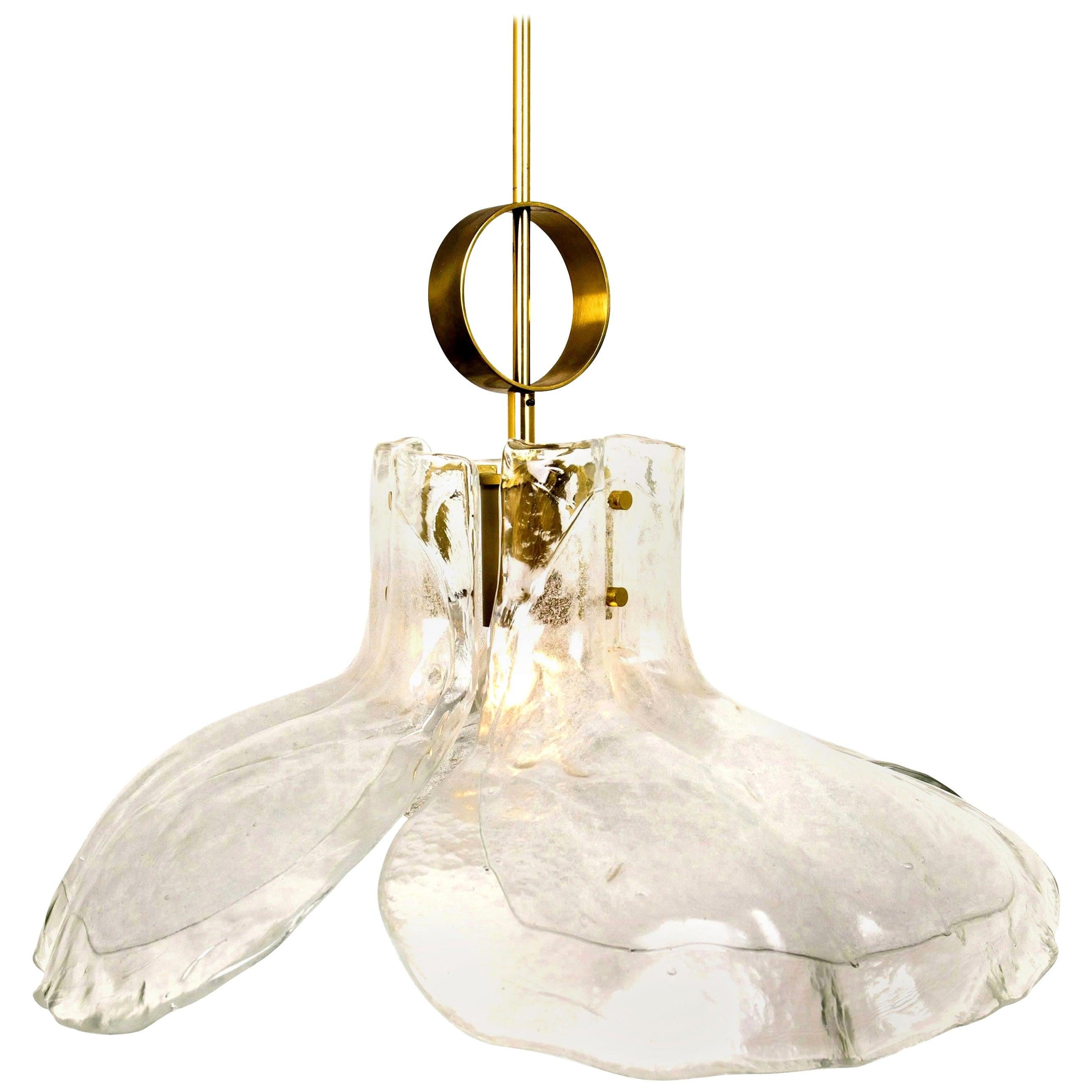 A beautiful mid century brass chandelier with four melting glass panels in the shape of a flower.

Designed and executed by Kalmar Vienna in the 1970s. Hand blown melting glass, made of clear glass. Has a very nice ornamental ring on its brass rod.