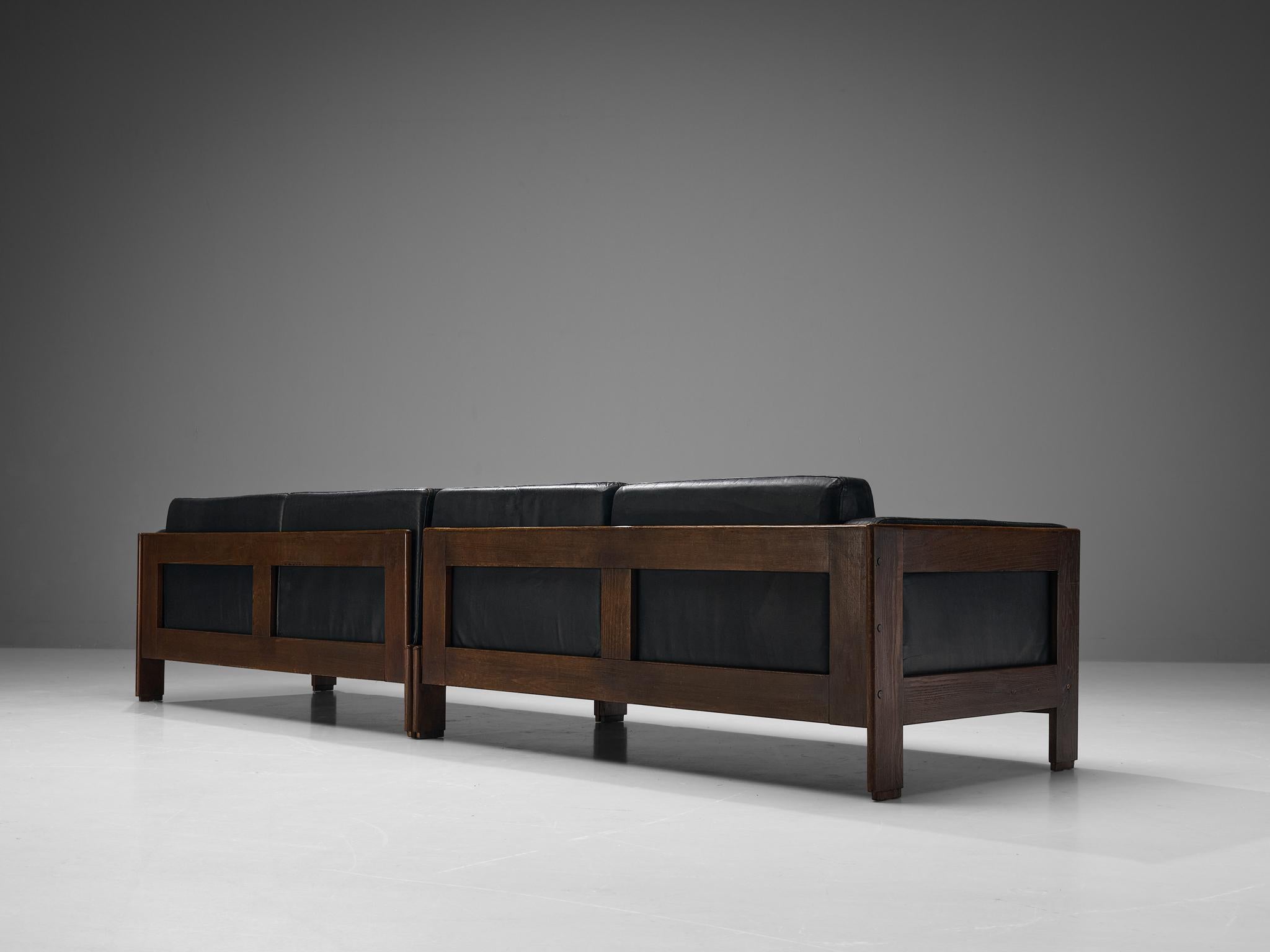 Four seat sofa, ash, patinated Leather, Europe, 1970s. 

Beautiful four seater sofa made with an ash frame and black leather upholstery. Its design strongly resembles the Bastiano sofa designed by Afra & Tobia Scarpa for Gavina in the sixties. The