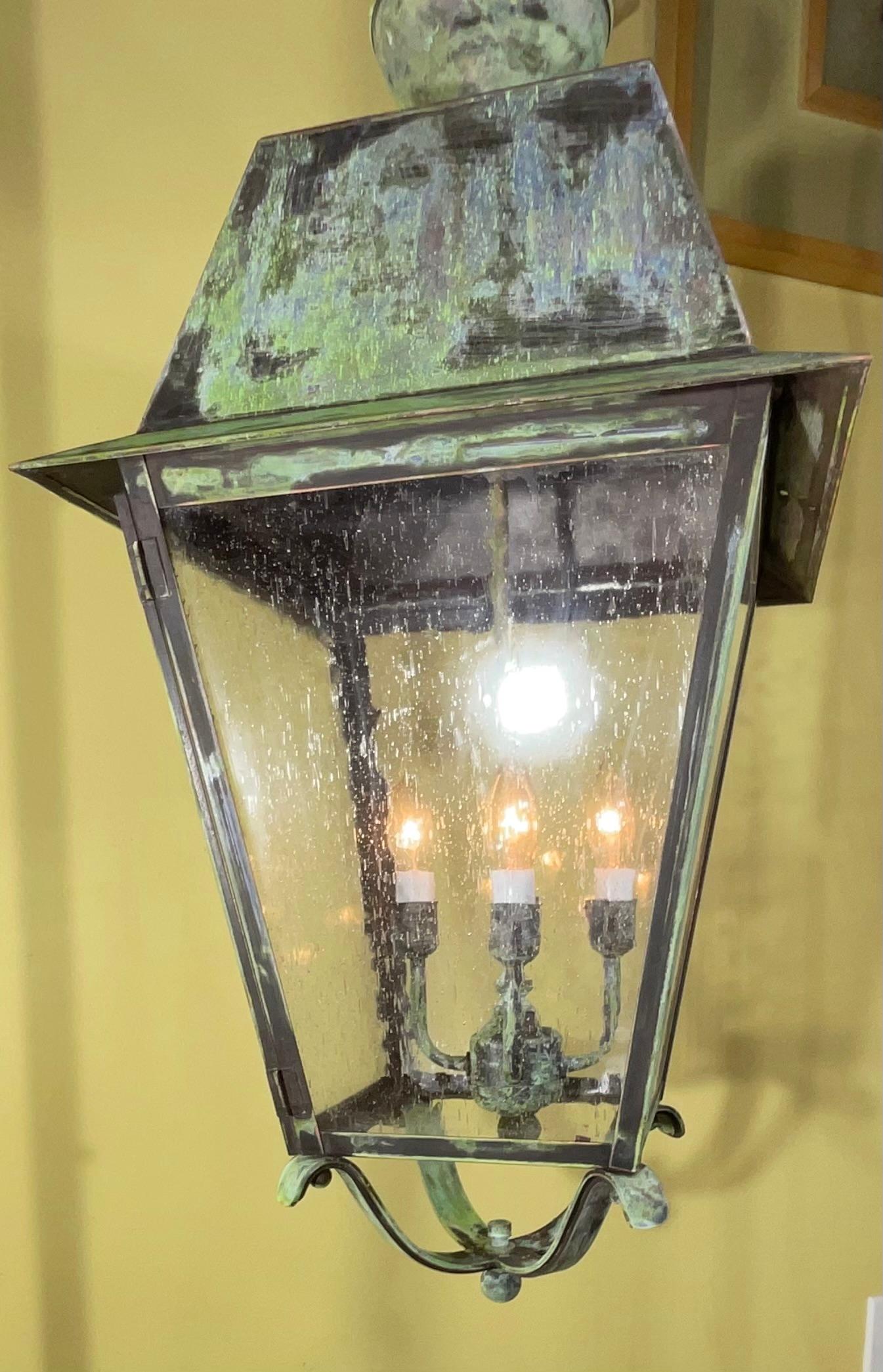 Elegant large hanging lantern handcrafted from solid brass, seeded glass ,
With four 40/watt lights, suitable for hanging in wet location, Ready to use.
canopy and chain included.

