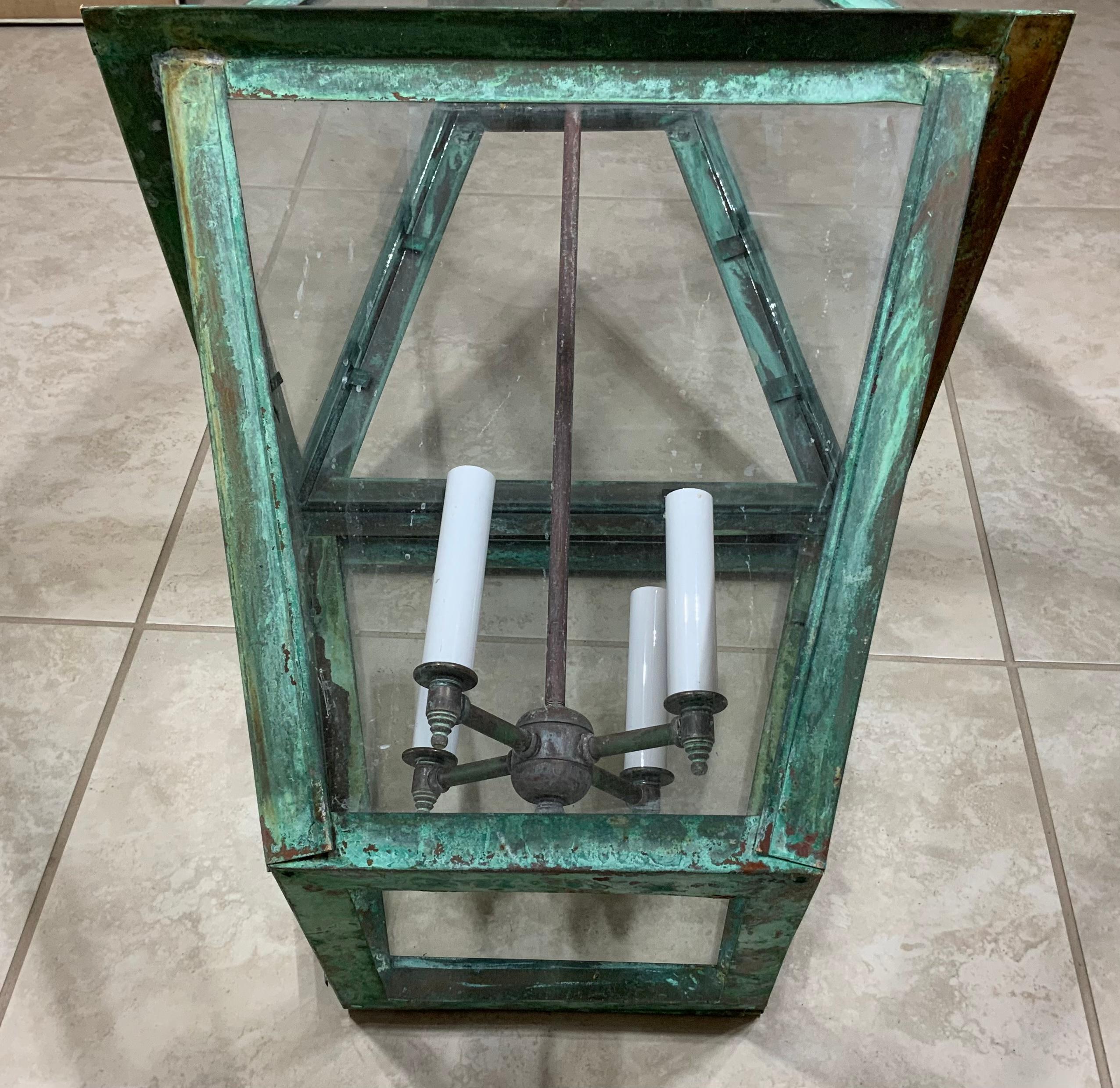 Quality hand forge solid copper lantern with four 60 watt lights.
Electrified and ready to light. Beautiful oxidization patina.
Made in the US and UL approved. Suitable for wet locations 
Copper canopy included.
Chain and canopy included.