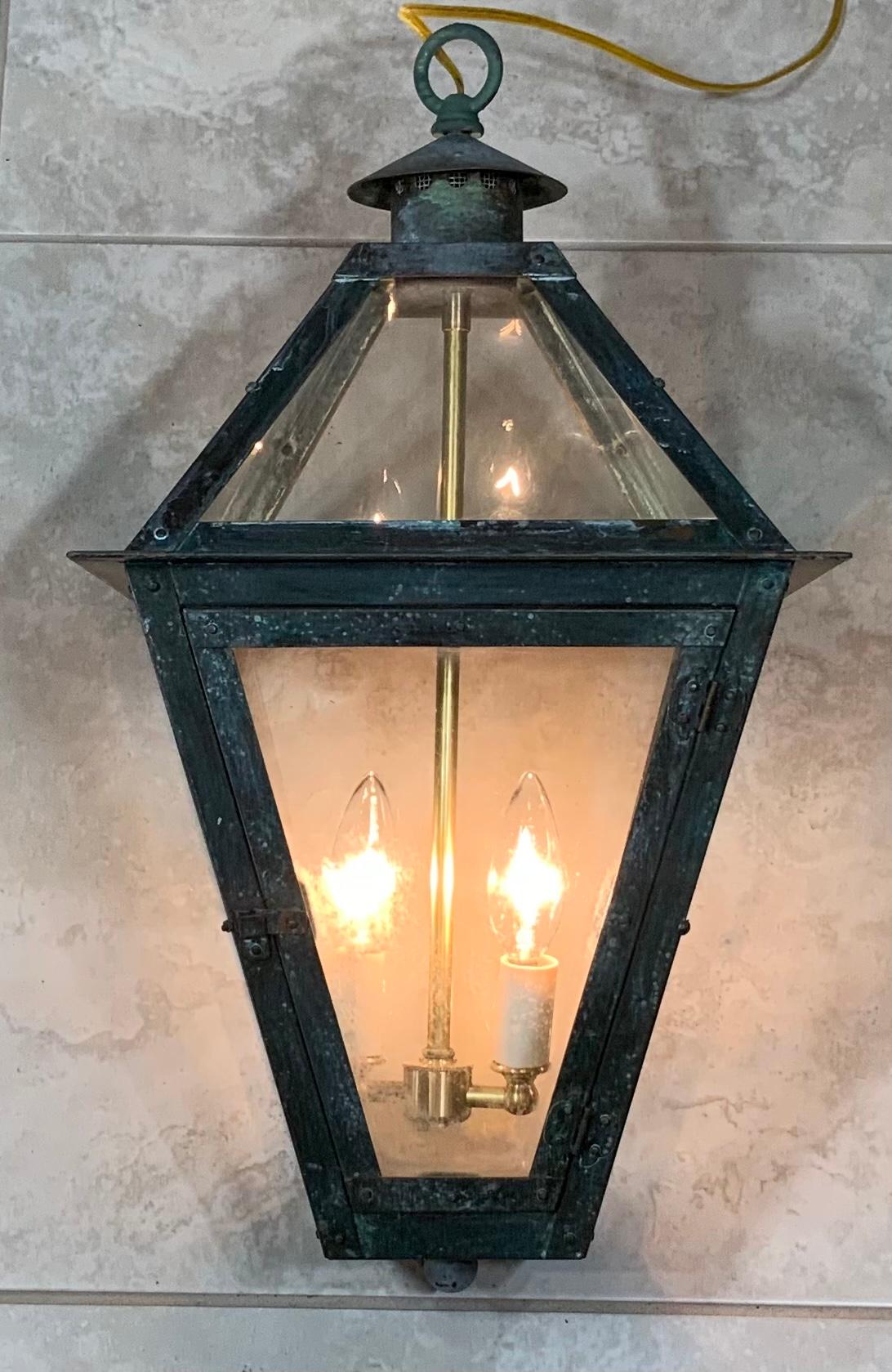 Quality hand forge solid copper lantern with two 60 watt lights.
Electrified and ready to light. Beautiful oxidization patina.
Made in the US, Suitable for wet locations 
Copper canopy included.
   