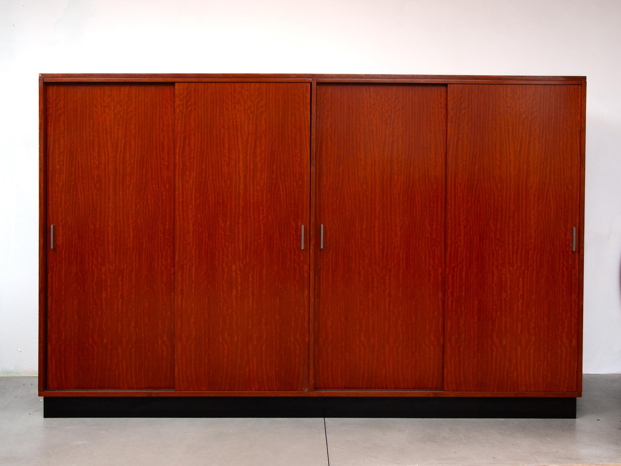 Beautiful sober cabinet in mirrored veneer, designed by Alfred Hendrickx for Belform, Belgium, 1960. This beautiful large cabinet, wardrobe suitable for hanging clothes on both sides, then 3 drawers and two shelves on the left under at the bottem a