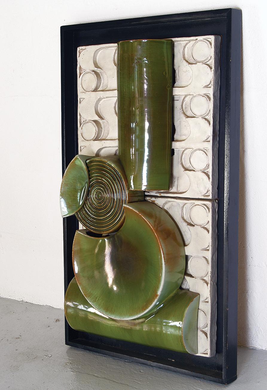A large three dimensional glazed, framed and wall-mounted 1960s-1970s Constructivist ceramic sculpture.
A very exciting and stylish piece of vintage wall art. Artist unknown. 
Measures: 52cm wide, 88.5cm tall and 14cm deep at its thickest part.
 
