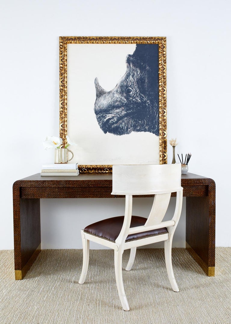 Captivating large drawing of a baby rhino's bust or head framed in a thick giltwood frame. Appears to be charcoal with pastel signed by artist on right bottom and labeled 