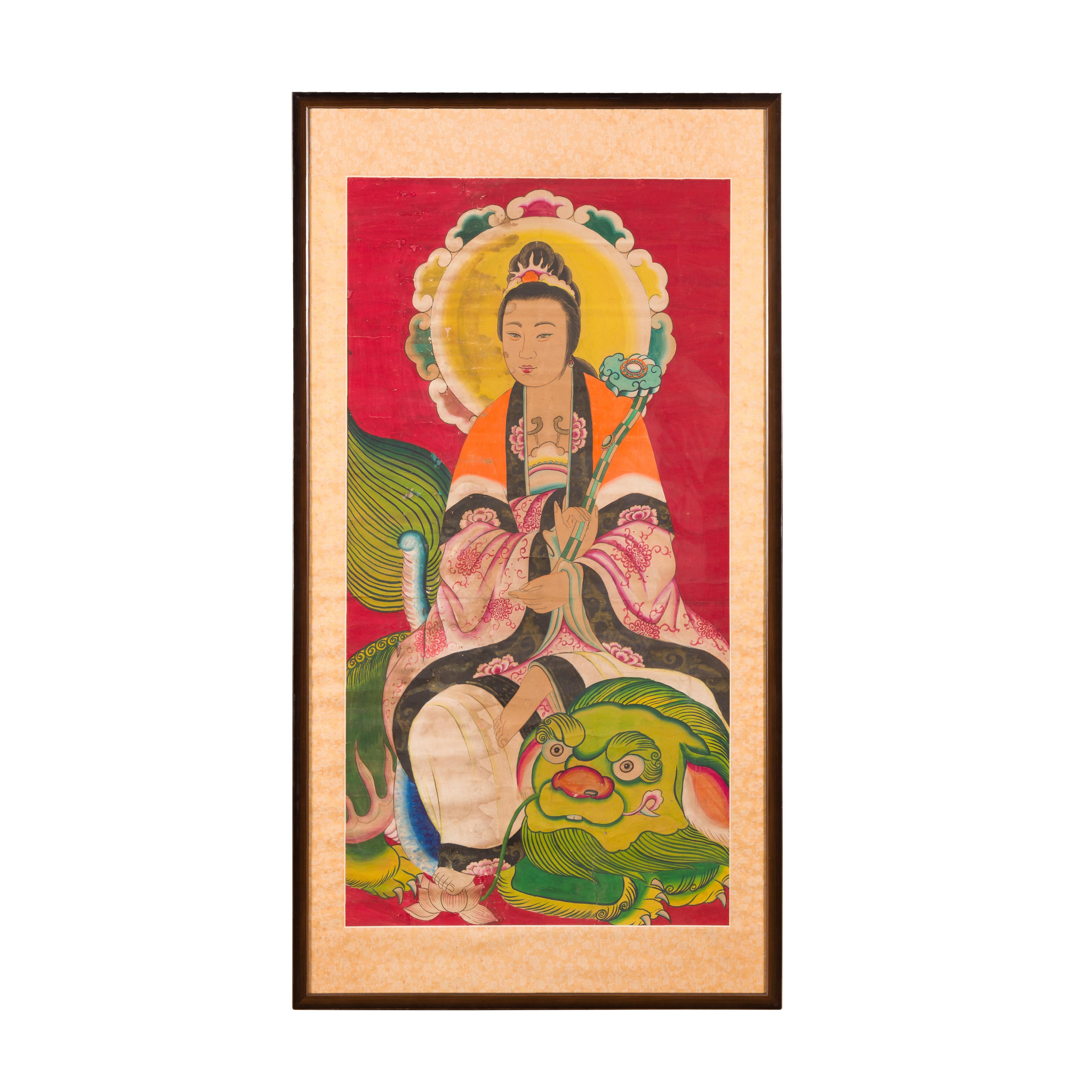 An antique Indian painting from the 19th century depicting Guanyin the Bodhisattva of Compassion sitting on a dragon. Created in India during the 19th century, this large painting features Guanyin the Bodhisattva of Compassion, sitting on the head