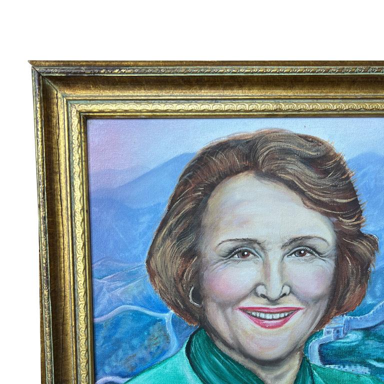 A large portrait painting of a woman in green. This large painting was created in 1991 and signed by the artist Tori Britt. It is painted on canvas and framed in a gilt wood frame. The subject is depicted from the chest up and features a woman with