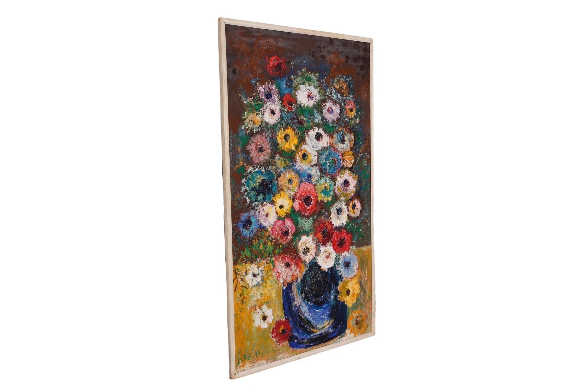 An original framed oil on canvas still life. A large blue vase of vibrantly multicolored anemones set on a yellow table is painted in the impressionist style, signed by the artist 