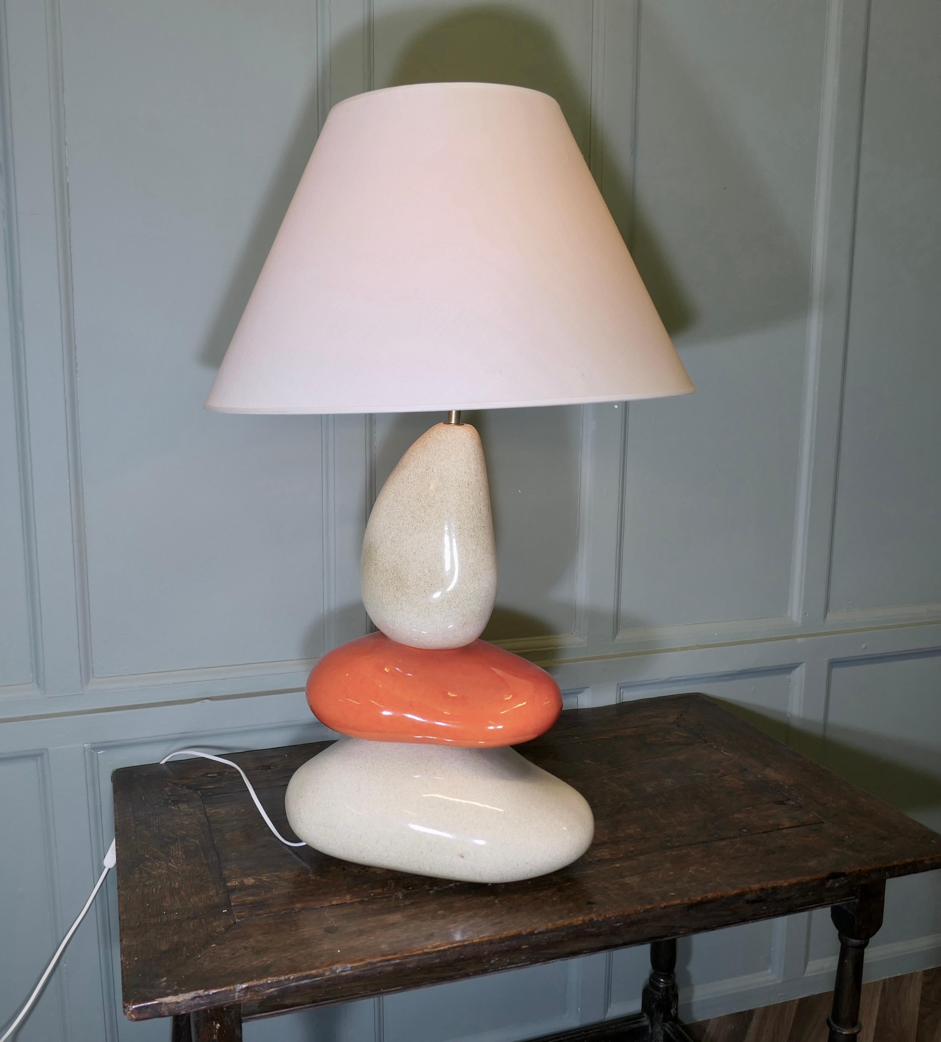 Large Francois Chatain Pebble Lamp from France

A Charming piece in Oatmeal and Orange /Red with a Coolie Lampshade
All working and a great looker
The lamp is 33” tall, and 22” in diameter at the shade
WE219
