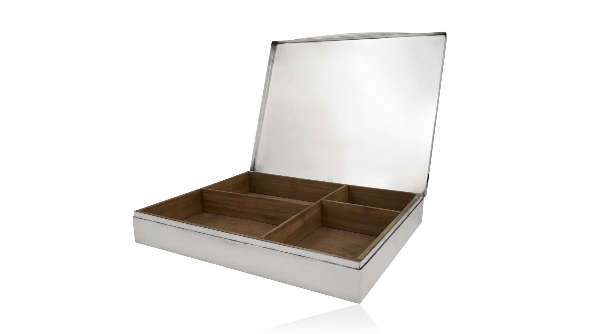 Large sterling silver box with compartmentalized wood interior, design by Svend Weihrauch for F. Hingelberg.
Measures: 13 3/4? x 11 3/4? x 2 3/8? (35cm x 30cm x 6cm). Weighs 147 oz (4,175g) in total including the wood lining.
Vintage hallmark for