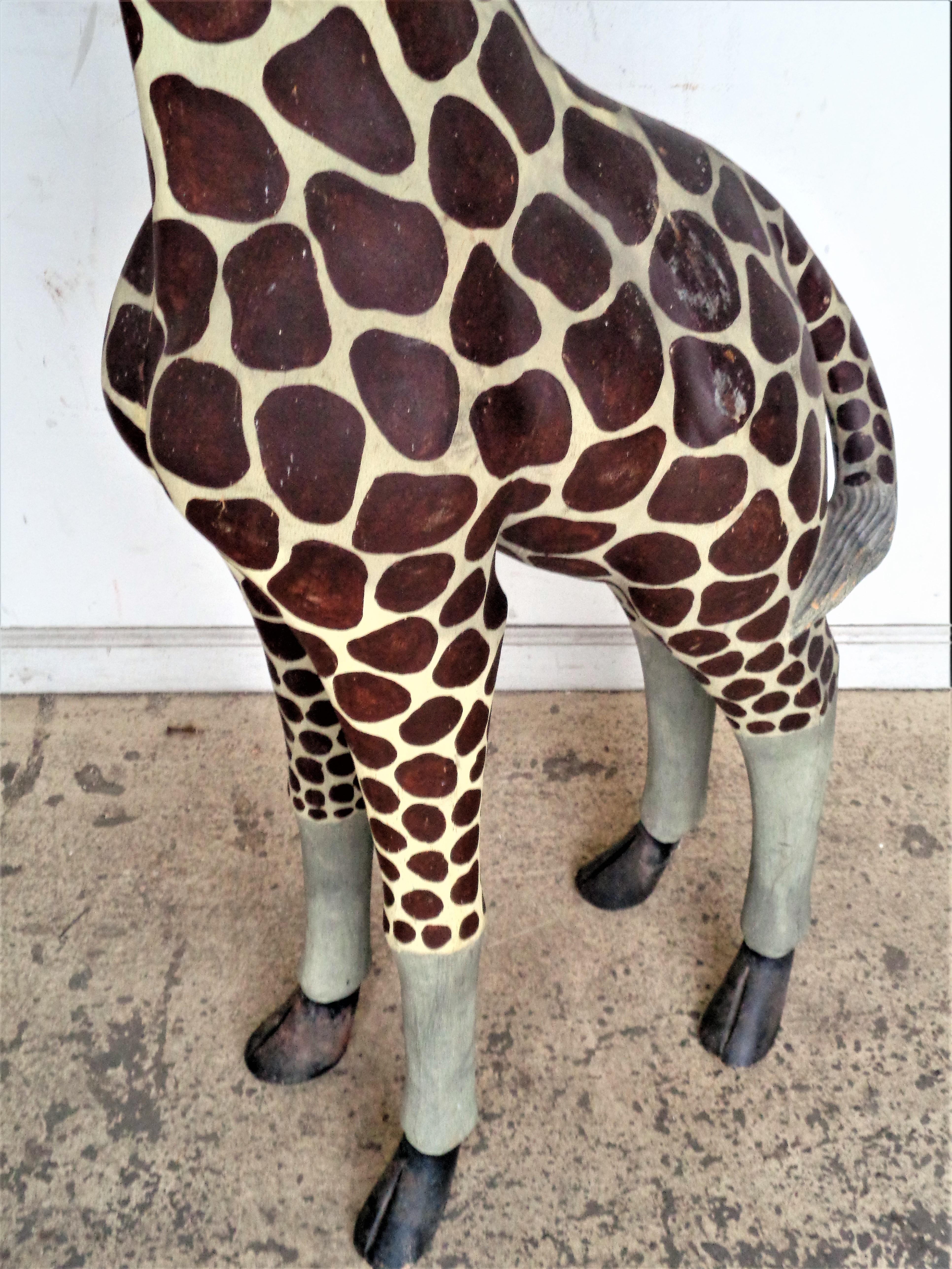 floor standing wooden giraffe