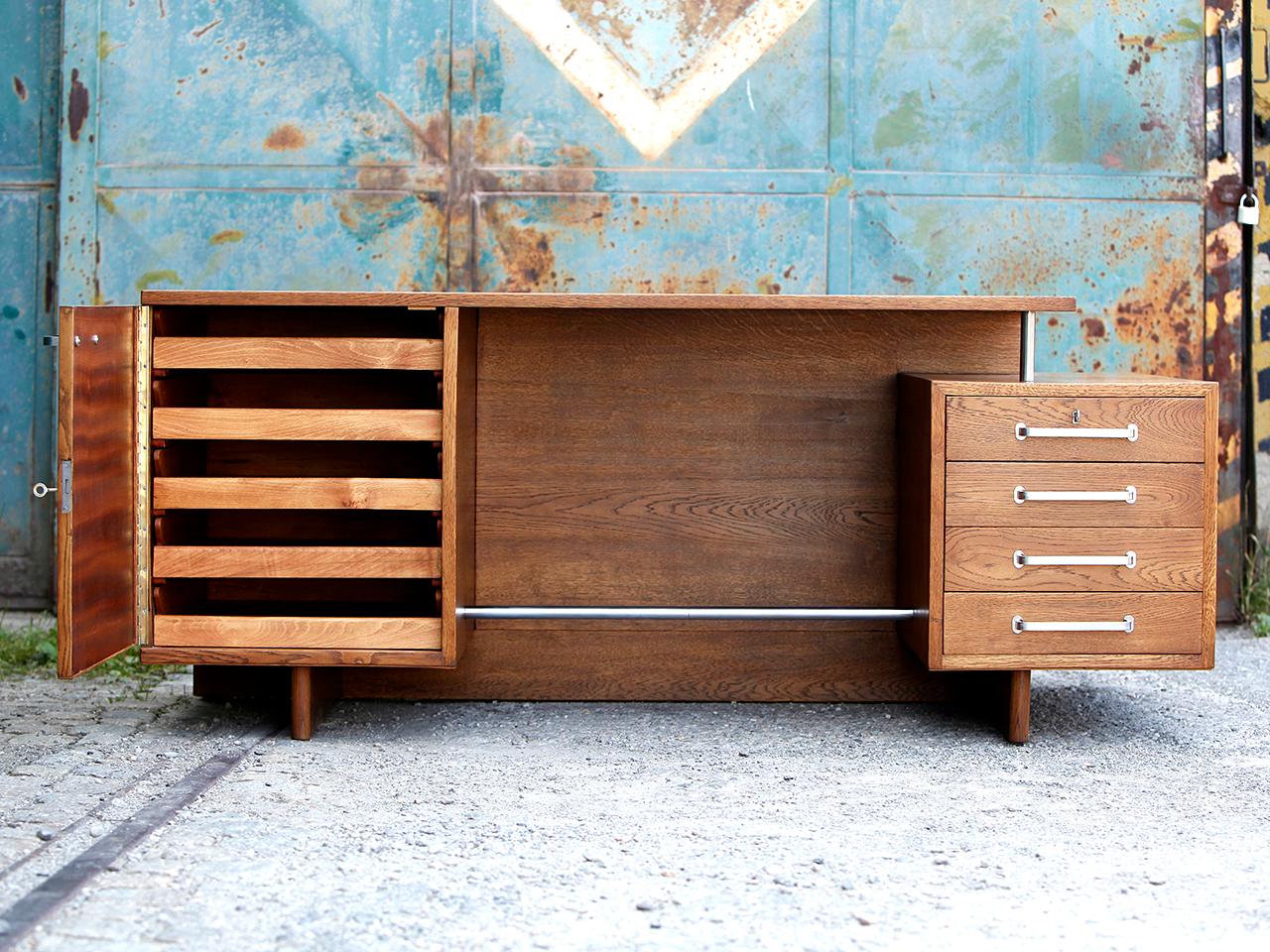 This unusually large freestanding functionalist desk was made in the 1930s in the former Czechoslovakia. Designed by Jiri Kroha (1893-1974), attributed. J. Kroha worked as an architect, designer, sculptor and painter. Execution in the early 1930s