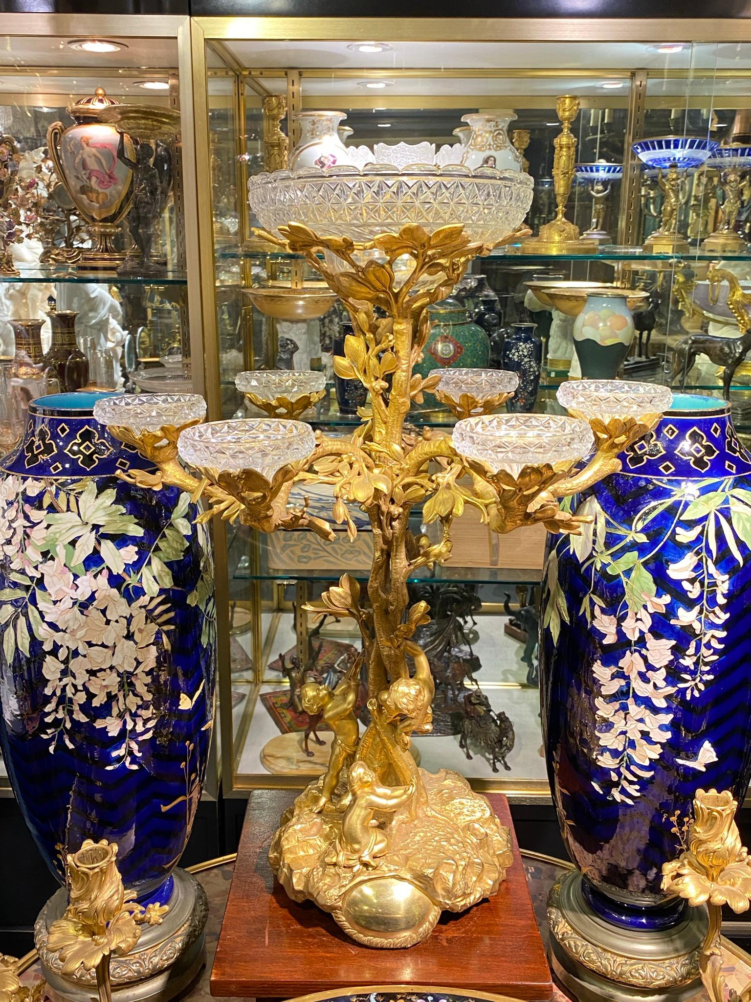 large and very fine quality French 19th century gilt bronze and cut glass epergne with cherub and bird motif.