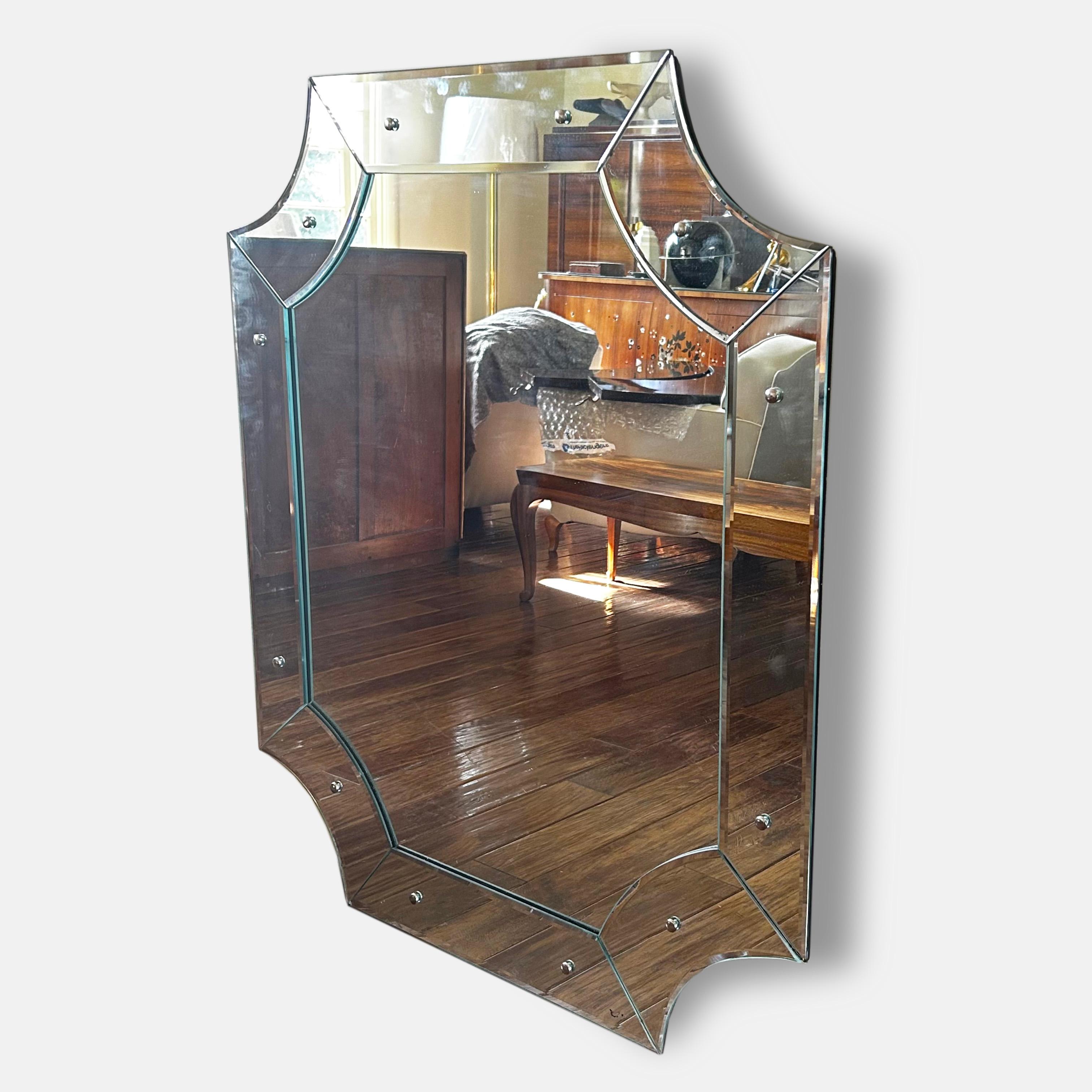 An elegant French 1940s wall mirror with mirror frame. 