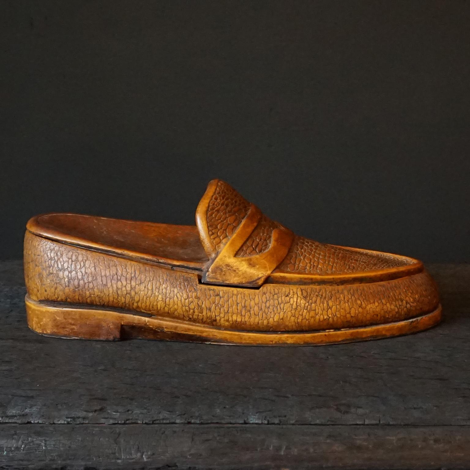 Very decorative larger than life French 1950s fake wood foam penny loafer with reptile design shoe-shaped box.
This funny item is in fact made from a high-density polyurethane foam and painted to look like a real carved wooden shoe. 
The